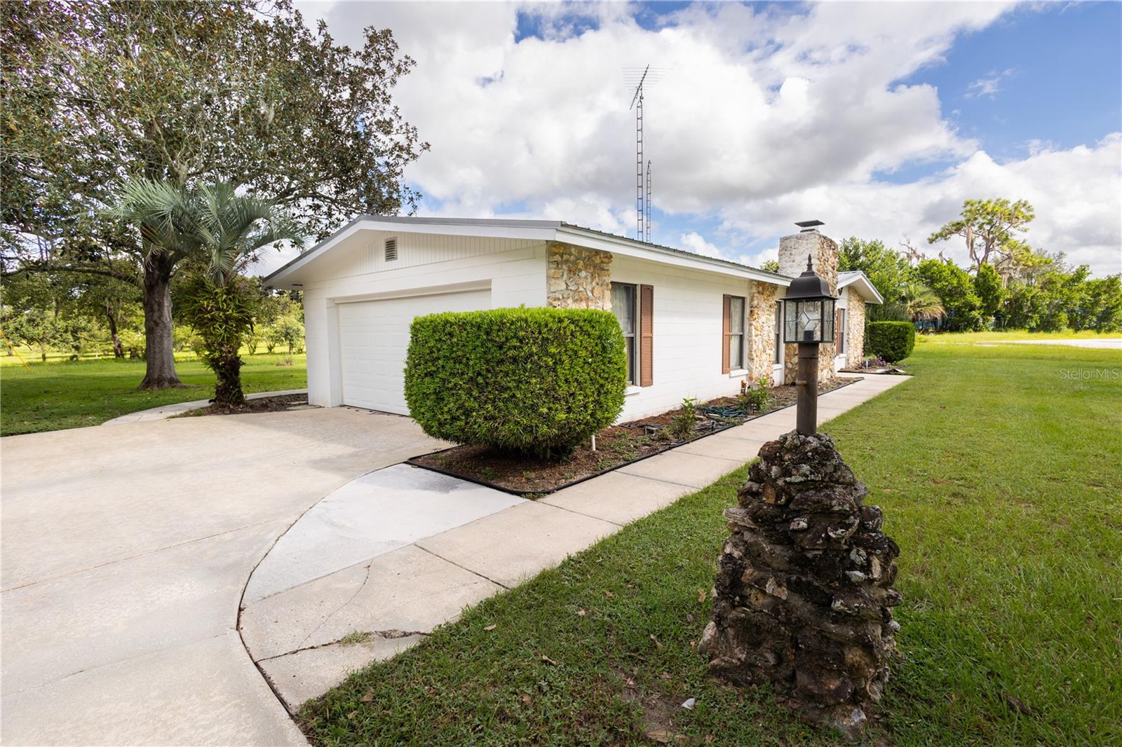Welcome to this charming 2-bedroom, 2-bath home located in the desirable Williston Highlands! Built in 1967 and situated on a spacious 0.32-acre lot, this well-maintained property offers 1,339 square feet of comfortable living space with beautiful golf course views from the backyard. Step inside to an inviting living room featuring a cozy fireplace. Additional living and entertaining space include a separate den/family room . Enjoy year-round comfort in the enclosed Florida room offering additional living space and peaceful views. Additional features include an attached garage with washer and dryer included, generous storage space, and a convenient location close to shopping, dining, and local amenities. Don’t miss this opportunity to own a golf course-adjacent home in the heart of Williston Highlands!