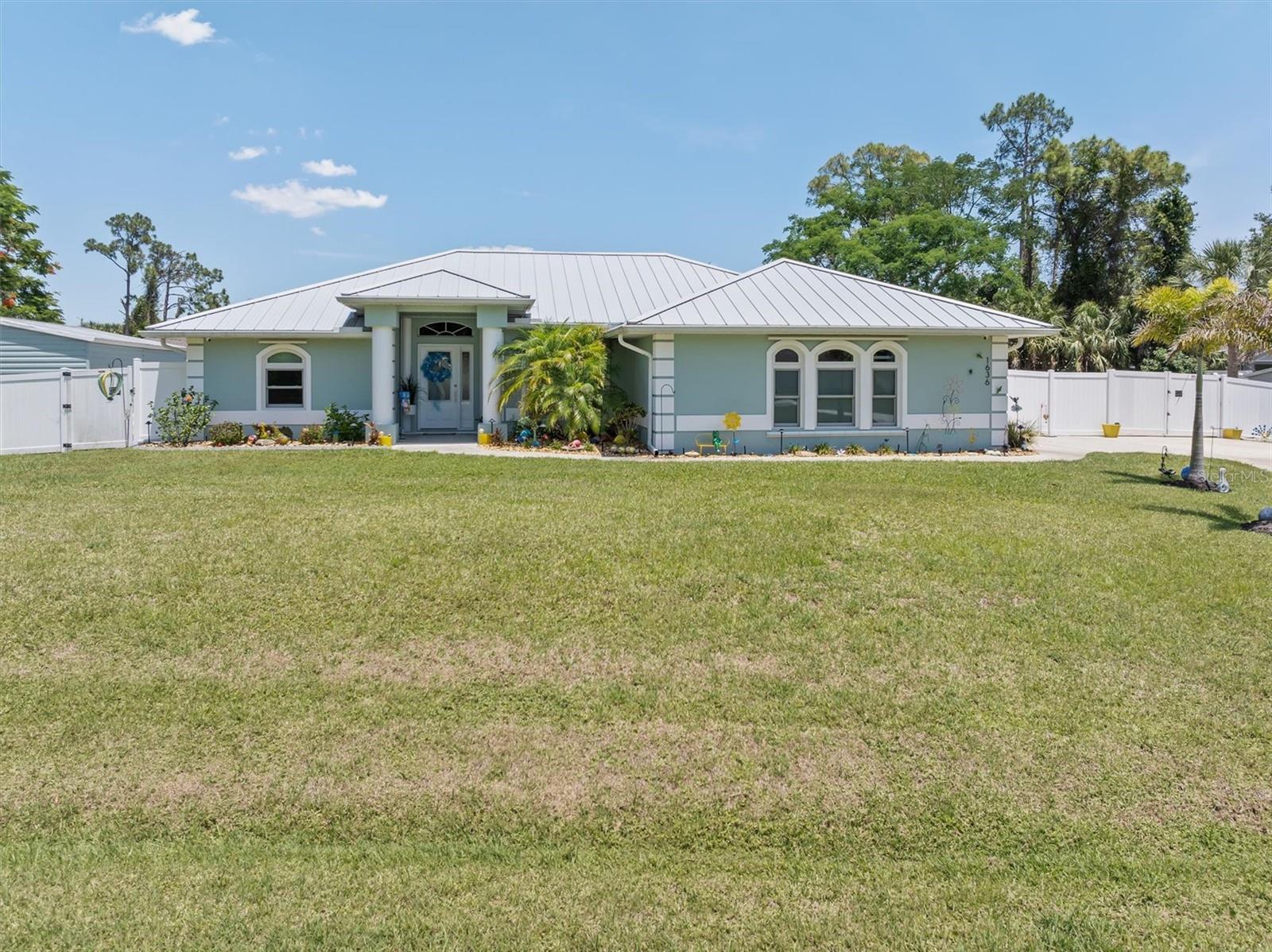 Offering two separate living spaces, Home and separate guest house, on a spacious half-Acre lot with boat/Rv Parking.    Welcome to your private slice of paradise, located on a quiet street, this super spacious, meticulously remodeled home offers, the perfect blend of luxury, comfort, and functionality. From the moment you arrive, you’ll appreciate the amazing landscaping, incredible privacy, and attention to detail throughout.  Mother-in-law retreat included, in their own space. 
Step inside to discover beautiful porcelain tile wood look throughout, power blinds, a desirable split-bedroom floor plan, and an open-concept layout designed for everyday living and entertaining. The stunning kitchen features gorgeous 42" tall wall cabinets, spacious panty, solid stone countertops, stainless steel appliances, an eat-at bar, and an abundance of cabinet and storage space. The beautifully updated bathrooms showcase stylish tile work and modern upgrades throughout. Spacious bright, laundry room with cabinets, countertop and exhaust fan.

Enjoy Florida living at its finest in the heated saltwater pool added in 2021, (new saltwater cell) surrounded by new pavers, landscape lighting and a large, well-maintained backyard enclosed with a privacy vinyl fence. There’s plenty of room for all your toys with boat and RV parking, plus a storage shed for added convenience. The private studio guest suite is perfect for visitors, extended family, or a home office.  This home is dog friendly, with doggie doors to get to the lanai and out to the yard with no issues.

Major updates provide peace of mind including a new metal roof (2023), A/C replacement (2022), a Generac whole-house generator, sprinkler system, new well pump, accordion hurricane shutters, hurricane screen in lanai, and 80% new hurricane impact windows. This home has been miraculously maintained and truly shows pride of ownership inside and out.  
The New Image school is minutes away, offering a campus for K-12, state of the art Athletics, Cambridge advanced studies, a family friendly campus.   Restaurants, shopping, Doctors all close by.  Beautiful beaches about 20 mins away and 75 close by.

If you’ve been searching for space, privacy, luxury upgrades, and a move-in-ready home that truly has it all, this one will not disappoint. Make this dream home yours today!