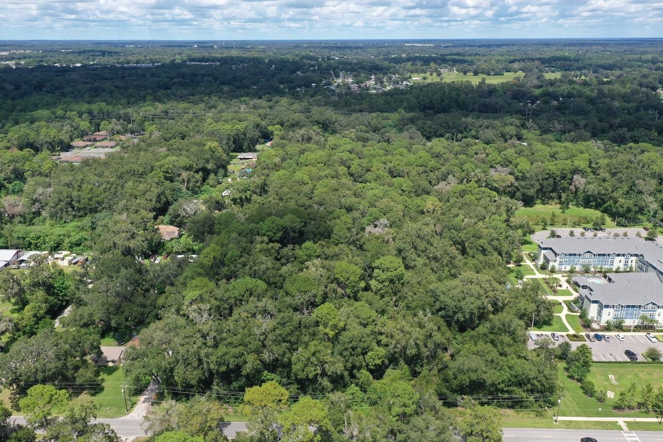Auction Property. LIST PRICE IS FOR MLS PURPOSES ONLY. ACTUAL PRICE WILL BE DETERMINED AT AUCTION. ONLINE AUCTION ENDS NOV. 12 AT 12 PM ET. 7.01± AC multifamily development opportunity. Zoned PD in established corridor. Previously approved for 84-100± multifamily units. Water and sewer available to site. Immediately adjacent to Oak Valley, a newer 96 unit multifamily community, reinforcing the established multifamily character of the location. Marion County's population has grown approximately 17.8% since 2020, supported by expanding logistics, manufacturing, healthcare and the region's multibillion dollar equine economy. Approximately 2.5± miles north of Historic Downtown Ocala, just off US 301/441, with convenient access to schools, healthcare, shopping, dining and employment. Direct road access with approximately 2,300± vehicles per day (2025 FDOT AADT)—well suited to residential access while remaining convenient to major transportation corridors. All acreage, zoning, density, utilities, development approvals, flood designation and other property information should be independently verified by prospective purchasers with the appropriate governmental and utility authorities. Property #: DG26042R. Online Auction Nov. 5 - 12. Subject to the final bid at the online auction and auction terms. 10% Buyer's Premium.
