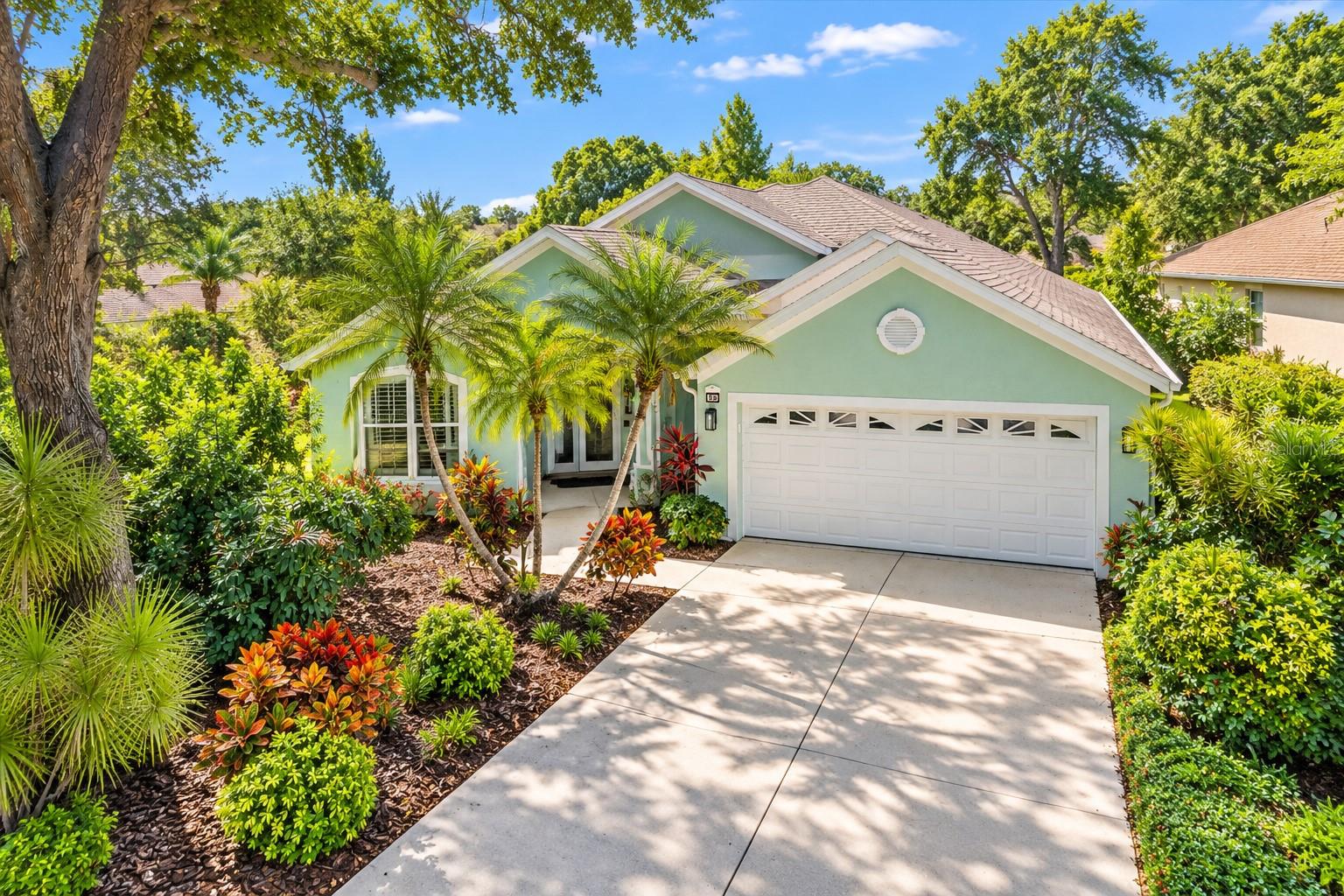 LOCATION, LOCATION, LOCATION! Welcome to this beautifully renovated residence in the desirable gated, maintenance-free community of Oak Court, conveniently located approximately 10 minutes from vibrant downtown Sarasota! Enjoy the best of Sarasota living, including the popular Saturday Farmers Market, an incredible variety of restaurants to satisfy every taste, boutique shopping, art galleries, live music, and endless entertainment. Sarasota's world-famous white sandy beaches are approximately 20 minutes away, depending on seasonal traffic.

THIS HOME IS A TRUE GEM! Completely renovated with exceptional style and attention to detail, this stunning residence offers an inviting living room, a spacious family room, an elegant formal dining room, and a beautifully designed modern kitchen. Gorgeous flooring flows throughout, creating a seamless blend of sophistication and comfort. The luxurious primary suite features a spectacular, Ritz-Carlton-inspired bathroom, offering a private, spa-like retreat. A generously sized second bedroom and beautifully renovated guest bathroom provide comfort and convenience for family and visitors.

STEP OUTSIDE INTO YOUR OWN PRIVATE FLORIDA PARADISE! The spectacular outdoor living area will take your breath away! A large swimming pool with sparkling turquoise water invites you to relax and enjoy Florida's beautiful weather year-round. The expansive screened lanai offers the perfect setting for entertaining family and friends, hosting memorable gatherings, or simply enjoying a peaceful afternoon by the pool. Mature trees and lush tropical landscaping surrounding the property create a serene atmosphere and add to its distinctive Florida charm.

Enjoy the privacy and peace of mind of living in a gated, maintenance-free community, where you can spend less time worrying about exterior upkeep and more time enjoying the exceptional Sarasota lifestyle.

BEAUTIFULLY RENOVATED, EXCEPTIONALLY LOCATED, AND READY TO ENJOY! THIS HOME IS A MUST-SEE!