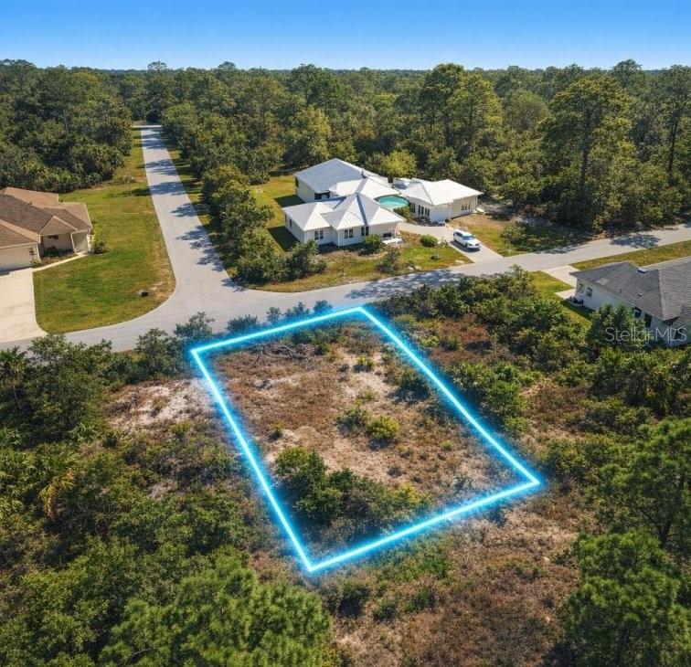 BUILD YOUR FLORIDA DREAM IN NORTH PORT! Located in Residential, Low zoning, the property is ideally suited for a single-family homesite, subject to normal City permitting and development requirements. The lot is also located in Flood Zone X, an attractive feature for buyers looking to avoid many of the higher-risk flood areas closer to the Gulf. The surrounding neighborhood primarily uses private wells and septic systems, with electricity available in the area. Paved road access, while shopping, restaurants, schools and everyday conveniences are only a short drive away. Street # is approximate for mapping. No USPS issued yet.