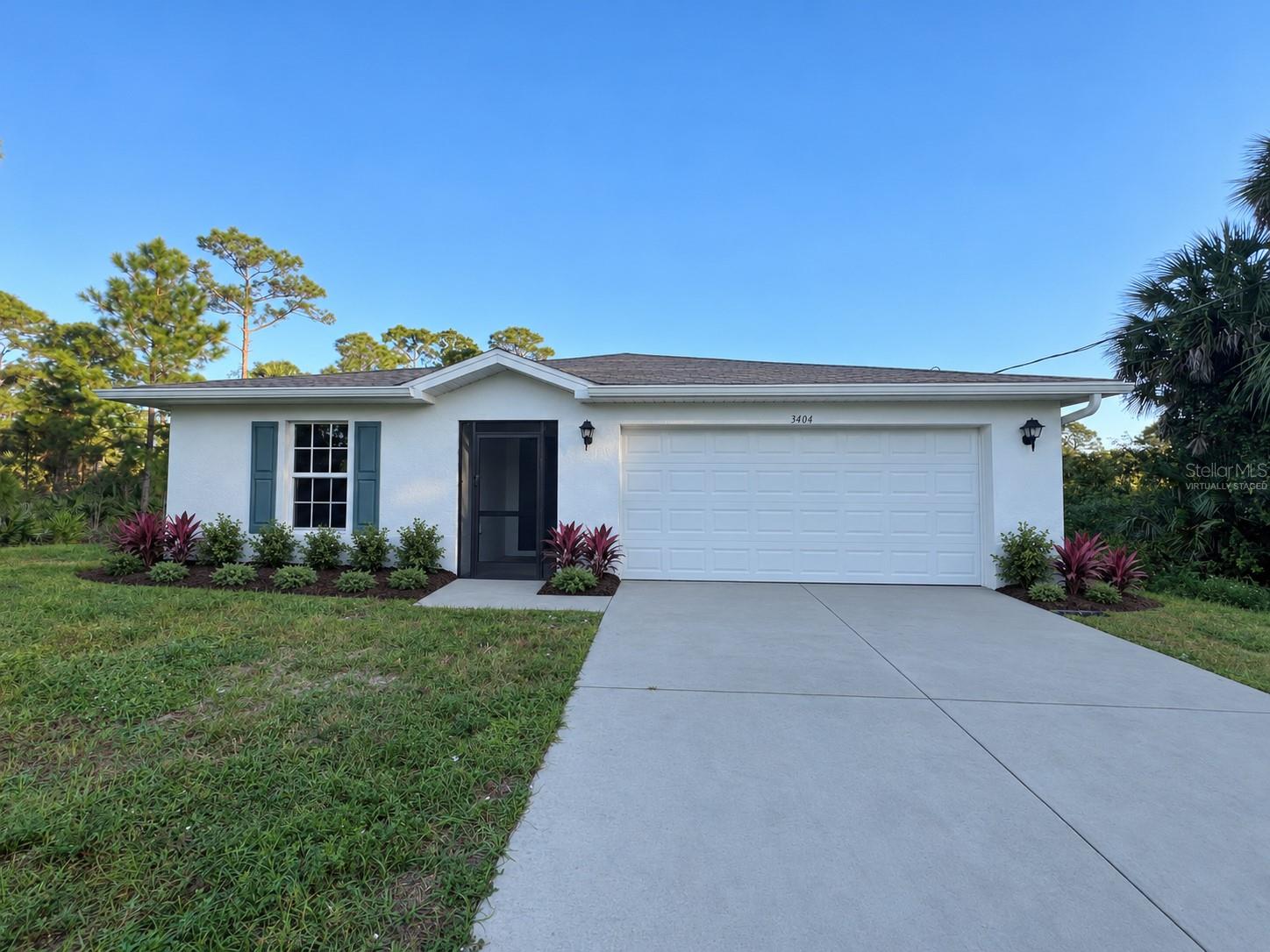 Enjoy privacy and a secluded setting with this 2023-built, four-bedroom, two-bath home on a quarter-acre lot in Lehigh Acres. Featuring impact-glass windows and screened patios at both the front and back, this home offers comfortable indoor and outdoor living. New waterproof laminate complements the existing tile for hard-surface flooring throughout—no carpet! The open layout connects the spacious living area to a kitchen with white cabinetry, stainless-steel appliances, and a breakfast bar. The primary suite includes a private bathroom and walk-in closet, while an attached two-car garage provides parking and storage. Water treatment system and well pressure tank replaced in March 2025. Fresh landscaping adds curb appeal, and the backyard offers space to relax and enjoy the peaceful surroundings. No HOA!