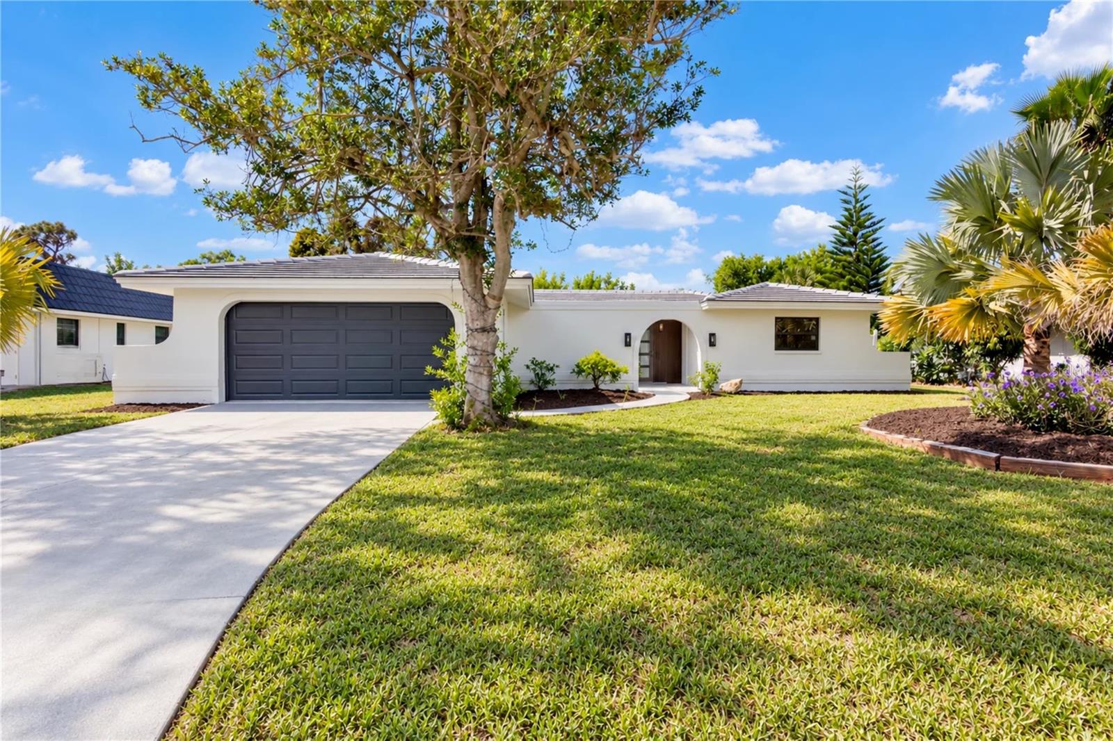 Virtually Staged. Welcome to a beautifully reimagined 3-bedroom, 2-bath pool home with a versatile den, completely remodeled from top to bottom and ready for its next owner! Nearly every detail has been thoughtfully updated, offering the look and feel of a new home with the charm of an established Florida property. Major improvements include a BRAND-NEW TILE ROOF, NEW HURRICANE IMPACT WINDOWS AND DOORS, NEW AIR CONDITIONER, NEW WATER HEATER, fresh interior and exterior paint, new flooring throughout, and all-new light fixtures and ceiling fans. The new thermostat is a smart thermostat able to be controlled from anywhere. At the heart of the home is a stunning designer kitchen featuring new appliances, stylish finishes, and a dedicated wine refrigerator, creating the perfect space for both everyday living and entertaining. Step outside to your own private Florida retreat, where the pool has been freshly resurfaced and outfitted with new mechanical equipment. The rear patio features a newly installed aluminum screen enclosure, providing an ideal space to relax, entertain, and enjoy the Florida lifestyle year-round. The updates continue with a brand-new hurricane-rated garage door and new garage door motor. With three bedrooms, two full bathrooms, a flexible den, private pool, and an extensive list of recent upgrades, this home offers exceptional peace of mind and truly move-in-ready living. Conveniently located in Englewood (10 MINUTES FROM MANASOTA BEACH), located in the ideal FLOOD ZONE X, with easy access to shopping, dining, recreation, and the beautiful Gulf Coast beaches.