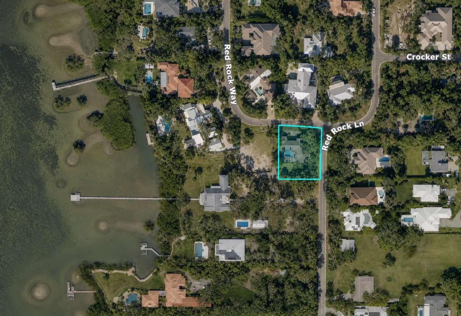 Pre-Construction. To be built. Introducing an exceptional new custom residence that redefines contemporary luxury in Sarasota's coveted West of Trail neighborhood. Thoughtfully conceived for today's discerning buyer, this architectural masterpiece blends sophisticated design with effortless indoor-outdoor living, creating a private retreat just moments from Siesta Key and Downtown Sarasota.
Designed with elegance and versatility in mind, the home features four luxurious bedroom suites, a study and five impeccably appointed baths, including two primary suites—an increasingly sought-after feature ideal for multigenerational living, extended family, or long-term guests.

Adding to its uniqueness is a private poolside casita, complete with its own en-suite bath, offering a true guest retreat with direct access to the resort-style outdoor living spaces. Whether used for visiting family, a live-in caregiver, a private office, or wellness studio, the casita provides exceptional flexibility rarely found in luxury new construction.

At the heart of the residence, the dramatic great room flows seamlessly into a designer kitchen showcasing premium appliances, custom cabinetry, an oversized waterfall island, and elegant entertaining spaces framed by walls of glass overlooking the outdoor oasis.

The principal owner's suite is a sanctuary of comfort featuring a spa-inspired bath, generous walk-in wardrobes, and direct access to the pool terrace. Every finish throughout the home has been selected with uncompromising attention to detail, including wide-plank flooring, designer lighting, impact-rated glass, smart-home integration, and custom millwork.

Outdoor living is elevated with a spectacular resort-inspired pool and spa, expansive covered lanai, summer kitchen, and beautifully landscaped grounds situated on an approximately 5,805-square-foot corner homesite. Every space has been designed to embrace Sarasota's year-round indoor-outdoor lifestyle.

Located in the prestigious Red Rock Terrace neighborhood, this exceptional residence offers convenient access to Siesta Key Beach, Southside Village, Downtown Sarasota, premier dining, private clubs, marinas, and the area's renowned arts and cultural attractions.

Offered as a rare pre-construction opportunity, buyers may have the ability to personalize select finishes during construction. A residence of this caliber—featuring dual primary suites and a private poolside casita—is a rare offering in one of Sarasota's most desirable locations.

Renderings are artist's conceptual representations provided for illustrative and marketing purposes only and are not intended to represent the completed residence with absolute accuracy. Final construction may vary from the renderings, including but not limited to architectural details, dimensions, materials, finishes, colors, landscaping, vegetation, pool and spa features, outdoor living areas, furnishings, lighting and surrounding properties. Furnishings and decorative items shown are for visualization purposes and may not be included in the sale. Buyers should rely on the applicable construction plans, specifications, contracts and other governing documents to determine the actual design, features and improvements included with the property.