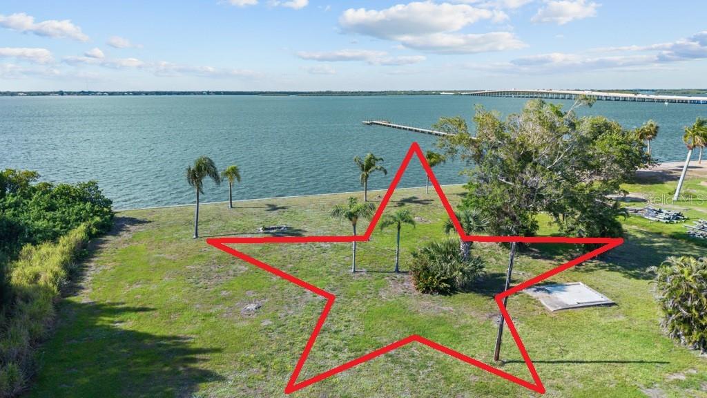 Instant Equity Opportunity!! Priced $125,000. below recent appraisal! Welcome to an extraordinary waterfront estate opportunity in the heart of Punta Gorda! Set on nearly 2 rare acres with approximately 200 feet of waterfront frontage and seawall, 26014 Shore Dr offers an unmatched combination of privacy, space, and panoramic water views that are becoming increasingly difficult to find in Southwest Florida. This remarkable property provides the ideal setting to create a true coastal retreat, with endless possibilities for outdoor living, boating, and entertaining.

For fishing enthusiasts, this location is a dream come true. Enjoy direct access to some of the area’s most sought-after fishing waters, known for incredible catches of snook, redfish, tarpon, and trout right from your backyard or just minutes away by boat. Whether you enjoy early morning casts from your seawall, sunset cruises, or full days on the water, this property delivers the ultimate Florida waterfront lifestyle.

The expansive nearly 2-acre homesite offers a level of privacy and open space rarely available in Punta Gorda waterfront properties. With approximately 200 feet of seawalled waterfront, there is ample room for docks, lifts, outdoor entertaining spaces, additional garages, guest homes, or creating your own private tropical paradise. The wide water views and breathtaking sunsets create an unforgettable backdrop every single day.

Located just minutes from vibrant downtown Punta Gorda, you’ll enjoy easy access to award-winning waterfront restaurants, boutique shopping, live music, farmers markets, marinas, parks, golf courses, and the scenic Harborwalk. Downtown Punta Gorda is beloved for its charming coastal atmosphere, boating culture, and endless year-round events that make it one of Southwest Florida’s most desirable destinations.

Rarely does a property offer this much land, extensive waterfront frontage, exceptional fishing access, and close proximity to downtown Punta Gorda all in one package. 26014 Shore Dr is a truly unique opportunity to own a premier piece of Southwest Florida waterfront paradise.

Potential Additional Development Opportunity: The property may offer the possibility of being divided into two separate buildable lots, potentially creating one waterfront homesite and a second homesite closer to the road. The existing survey depicts two lots on the property, which may provide additional possibilities for future development or configuration. There may also be other options for providing access to the waterfront parcel, including a potential deeded access easement or other configuration.

All Lot-split, access, easement, zoning, building, development, and buildability possibilities are subject to applicable governmental approvals, restrictions, and requirements. Buyer is solely responsible for conducting their own independent due diligence and verifying all information, including but not limited to lot dimensions, zoning, density, subdivision requirements, waterfront access, easement options, utilities, and buildability, with the appropriate governmental agencies and qualified professionals.