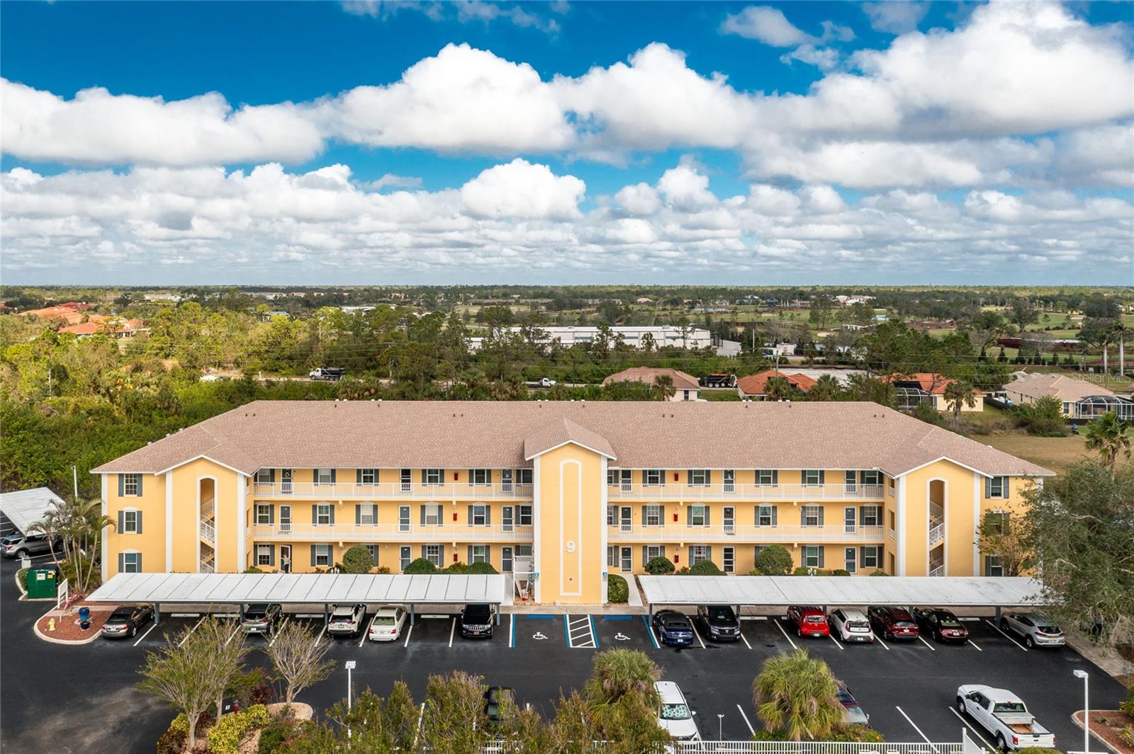 Relax and enjoy the charm of this immaculate and beautifully appointed second-floor condo in a cozy, PET-FRIENDLY neighborhood. Nestled in a peaceful setting yet conveniently close to shopping, restaurants, medical facilities, I-75, beaches, and beyond, this unit offers the perfect balance of tranquility and accessibility. Ample parking, including a COVERED CARPORT, and a private HEATED community POOL make this property even more desirable. Located near the elevator, the unit provides both a scenic view and easy access. This meticulously maintained condo boasts numerous updates and upgrades, including HURRICANE IMPACT WINDOWS (2017), HVAC system (2018), hot water heater (2022), and new ceiling fans (2023). Stylish porcelain tile was installed in the entryway, kitchen, and baths in 2018, while a complete kitchen renovation in 2021 introduced new cabinetry, granite countertops, and a large pantry cupboard. The living areas feature durable laminate plank flooring (2022), and the en-suite bathroom has been remodeled with Corian counters, upgraded lighting, and more. This vibrant community and beautifully updated unit are ready for you to call home.