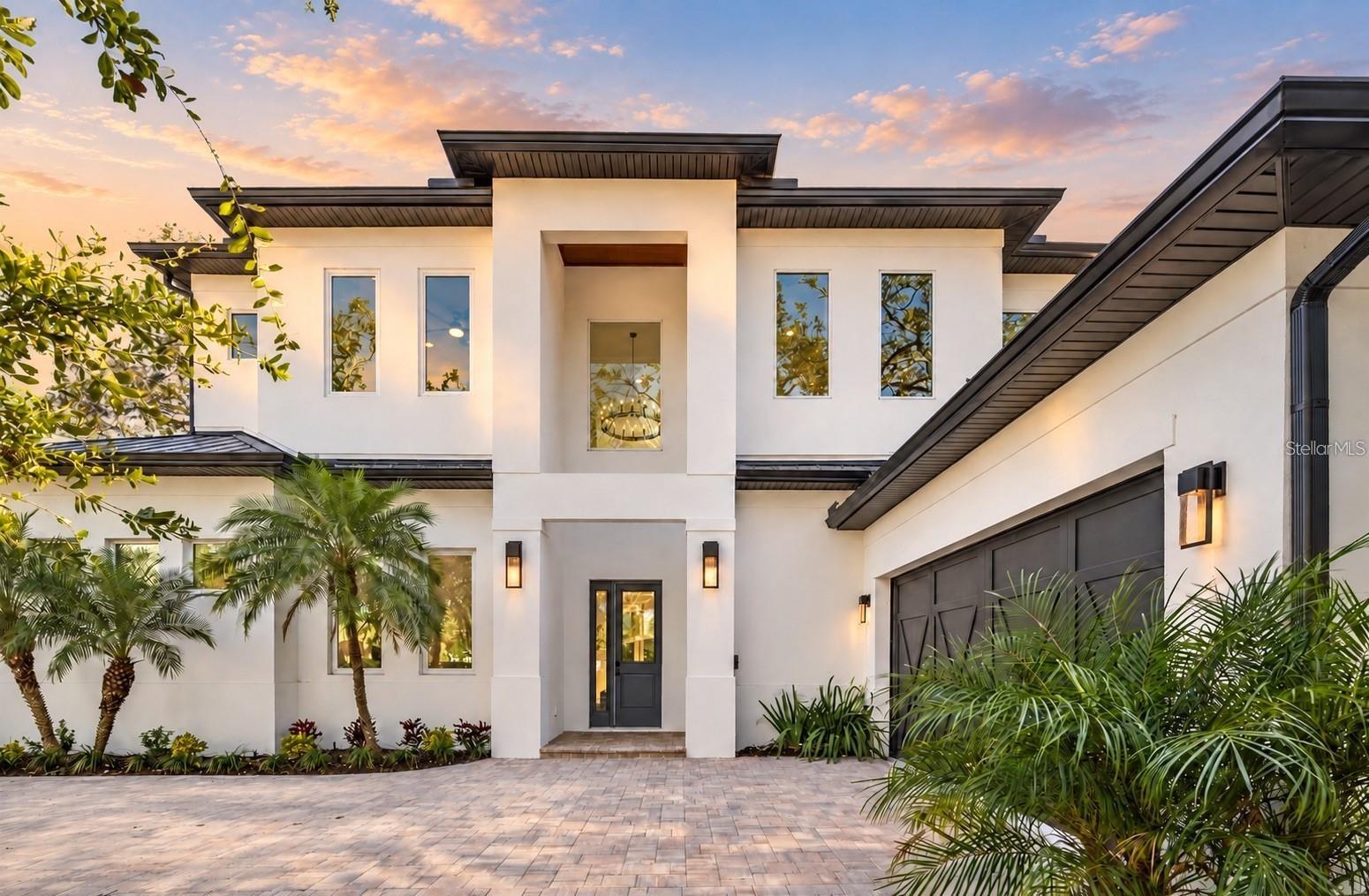 Introducing an exquisite New Construction, 3,356 sq. ft. with 5 bedrooms and 5 full bathrooms, home in the heart of Sarasota. Pool installation is in progress, with a projected completion of October. This stunning residence offers an unparalleled combination of luxurious comfort and unbeatable location, minutes from Downtown. As you enter this dazzling property, you will be greeted by an open and spacious floor plan that features high ceilings, natural light, and high quality finishes throughout.

The home features an elegant kitchen with top-of-the-line Fulgor Milano appliances, quartz countertops, and custom cabinetry. Two patios with an outdoor kitchen and additional island seamlessly blend indoor and outdoor living and lush landscaping. The master bedroom of this gorgeous home is a true sanctuary, offering a plush and peaceful retreat after a long day. With a high-ceiling and large windows to let in unrestricted natural light, providing a bright and airy feel that's perfect for relaxation. The room also features two generously sized walk-in closets. The master bathroom is equally impressive, featuring a soaking tub and a separate shower that's great for unwinding after a long day. The opulent finishes and high-end materials used throughout the space add to the lavish feel of this spectacular master suite, making it the best place to recharge and rejuvenate. The home also features several storage closets, a large laundry room, and ample storage space with room to add an elevator.

As you ascend the grand staircase to the upper level of the home, you are met with a second living room area, large balcony, and three cozy bedrooms with en-suite bathrooms. This setup is perfect for families or groups of friends looking to stay together in comfort and convenience. Situated between Siesta Key and Downtown Sarasota, you will have easy access to some of the best beaches, restaurants, and shopping. The home is also a few minutes’ walk from Arlington Park’s tennis courts and more. Whether you are looking for a day at the beach, a night out on the town, or a quiet evening at home, this home has everything you need. *There is some virtual staging imagery of the upcoming pool.
