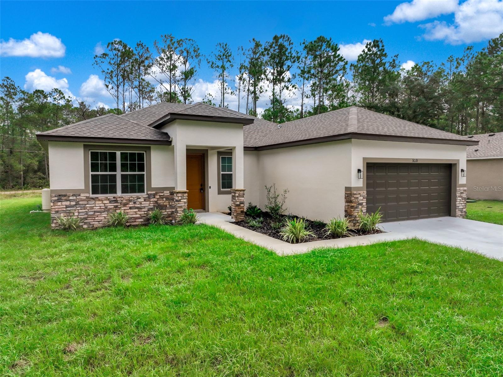 Discover modern Florida living in this beautifully crafted new construction home in the desirable Sun ’N Lake of Sebring community. Featuring 4 bedrooms, 2 bathrooms, and an open-concept design, this home combines stylish finishes with comfortable spaces for everyday living and entertaining. Ceilings reaching 9'4" and an elegant tray ceiling enhance the spacious living room, creating an open, welcoming feel. The kitchen brings everyone together with quartz countertops, a striking waterfall island, stainless steel appliances, a pantry, and generous workspace for preparing meals and hosting guests. Tucked away for privacy, the primary suite offers two walk-in closets and a thoughtfully appointed bathroom featuring dual vanities, an oversized walk-in shower with dual shower heads, a private water closet, and additional storage. A dedicated laundry room with a linen closet adds everyday convenience, while the covered rear patio provides a comfortable place to relax and enjoy Florida’s outdoor lifestyle. Quality craftsmanship is evident throughout. Served by a private well and septic system, this home is nestled on a large corner lot located in a golf cart-friendly community with access to two championship golf courses, pickleball and tennis courts, a community pool, fitness center, dog parks, a nature preserve, and miles of sidewalks. Nearby shopping, restaurants, and medical facilities put everyday essentials within easy reach. Come discover a home designed to make coming home something to celebrate!
