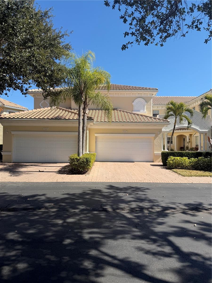This rare opportunity offers a perfect blend of luxury and comfort, featuring an expansive 3-bedroom plus den floor plan that maximizes natural light and living space. Positioned in a prestigious, gated, resort-style community, this end unit provides sweeping views of the pond and pool. Recent modern enhancements elevate the home’s appeal, including fresh laminate flooring, designer paint, updated lighting fixtures, and contemporary ceiling fans. The kitchen is a chef’s delight, outfitted with elegant granite countertops and high-end stainless steel appliances. Retreat to the primary suite, which serves as a peaceful sanctuary featuring decorative tray ceilings and a luxurious, newly renovated stone-floored shower. Additional highlights include soaring volume ceilings, a dedicated laundry room, a spacious 2-car garage, and the lasting value of a brand-new 2025 tile roof. Located just minutes from historic downtown Venice, pristine beaches, and premier dining, this residence is situated in a community offering an expansive clubhouse, fitness center, and scenic nature trails. 
This bright, airy 3-bedroom plus den, 2-bathroom end unit features a spacious 2-car garage on the ground level with the main living quarters positioned upstairs. The open-concept floor plan is flooded with natural light and showcases gorgeous, unobstructed views of the pond and pool area from both the expansive great room and the private primary suite. The interior feels brand new and pristine, boasting recent upgrades such as fresh laminate flooring, designer interior paint, updated lighting fixtures, and modern ceiling fans throughout. The kitchen is fully equipped and move-in ready, highlighted by elegant granite countertops and high-end stainless steel appliances. The primary suite serves as a serene private retreat, complete with decorative tray ceilings, generous dual closets, and an en-suite bathroom featuring a relaxing garden tub and a stunning, newly installed stone-floored shower. Additional perks include a large, dedicated laundry room, soaring volume ceilings, and the peace of mind provided by a brand-new 2025 tile roof. The property is completely move-in ready with ample space for guest parking. Please note that the owner is a licensed Florida real estate agent. Schedule your private showing today to experience everything this home has to offer!