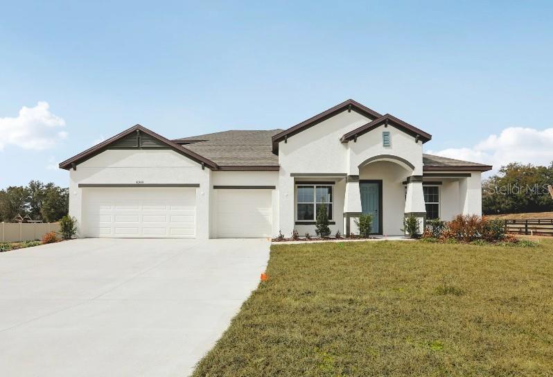 Pre-Construction. To be built. Located in the desirable Golden Gate community, the Sienna combines upscale finishes, spacious interiors, and thoughtful design on an expansive 2.73-acre homesite. Beautiful landscaping enhances the property, providing additional yard space and privacy, while the central location places outdoor recreation and everyday amenities within convenient reach. A covered front porch and impressive 8' full-lite front door create an inviting first impression.

Inside, soaring 10' ceilings complement custom interior paint, a deluxe interior trim package, and upgraded lever door hardware. The spacious foyer opens to a formal dining area and a private Den with two sets of French double glass doors. The open-concept Great Room features abundant natural light and additional LED lighting, flowing into the chef-inspired kitchen with quartz countertops, soft-close cabinetry, stainless steel appliances, a wet bar with wine cooler, and an oversized center island. A bright breakfast nook completes the kitchen and dining area.

The covered lanai features an acrylic finish, extending the living space outdoors for dining or relaxing while enjoying the peaceful surroundings.

The luxurious owner's suite features generous space, a large walk-in closet, and a spa-inspired bath with an oversized tile shower, upgraded quartz countertops, and designer finishes. Secondary bedrooms each include walk-in closets, while the secondary baths feature upgraded countertops, a tiled tub and shower combination in one bath, and a full tile shower in the third bath.

Ceramic tile flooring extends throughout the main living areas, while the bedrooms provide added comfort and privacy. Additional features include an upgraded laundry room with quartz countertop, Deako Smart Switches, a Smart Thermostat, and a Keyless Entry Smart Door Lock. The spacious 3-car side-entry garage provides ample room for vehicles, storage, and recreational equipment.

Set within a desirable lakefront community, this beautifully appointed Sienna combines expansive acreage, premium finishes, and modern conveniences, all backed by a full builder warranty. Schedule your private tour today. We can’t wait to welcome you home!