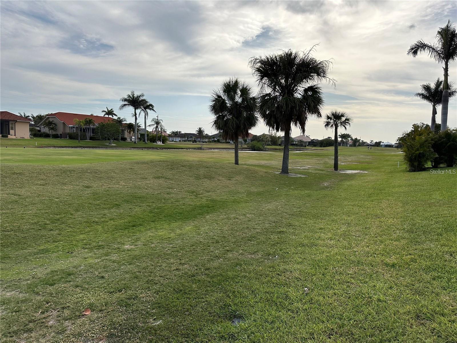 Over half an acre with southern exposure on the St. Andrews South Golf Course—zoned GM-15 Multi-Family! Build your dream Florida estate or develop up to 8 units—whether you’re envisioning luxury villas or a private retreat. This rare double lot is ideally located in the heart of Punta Gorda Isles, surrounded by championship golf, waterfront dining, Fishermen’s Village, Charlotte Harbor, and world-class boating and fishing. St. Andrews South Golf Club memberships were available at the time of listing—an added bonus for avid golfers. Enjoy easy access to pickleball, biking trails, shopping, and more. An unbeatable lifestyle opportunity—secure your slice of paradise today!
