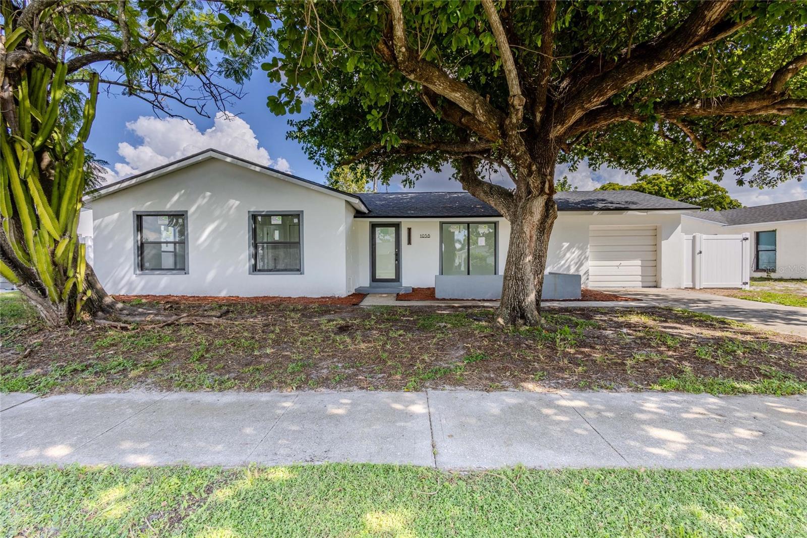 COMPLETELY RENOVATED INSIDE & OUT! NEW ROOF, NEW IMPACT WINDOWS, NEW PORCELAIN TILE FLOORS, FULLY REMODELED KITCHEN & BATHROOMS, AND FRESH INTERIOR & EXTERIOR PAINT! Discover this beautifully updated 3-bedroom, 2-bathroom home offering 1,288 sq. ft. of living space in North Fort Myers. This extensive renovation goes far beyond cosmetic upgrades, featuring a complete plumbing repipe, a new water heater, and modern finishes throughout. The stunning kitchen showcases brand-new cabinetry, countertops, and appliances, including a range with oven and an over-the-range microwave with built-in ventilation. Both bathrooms have been completely transformed with new vanities, modern showers, updated fixtures, and sliding glass shower doors. Additional features include a dedicated laundry room and an enclosed one-car garage. Step outside to enjoy an open-air patio and a private backyard surrounded by a BRAND-NEW WHITE PVC FENCE. FROM MAJOR SYSTEM UPGRADES TO BEAUTIFUL FINISHING TOUCHES, THE WORK HAS ALREADY BEEN DONE! Schedule your private showing today and see the transformation for yourself!