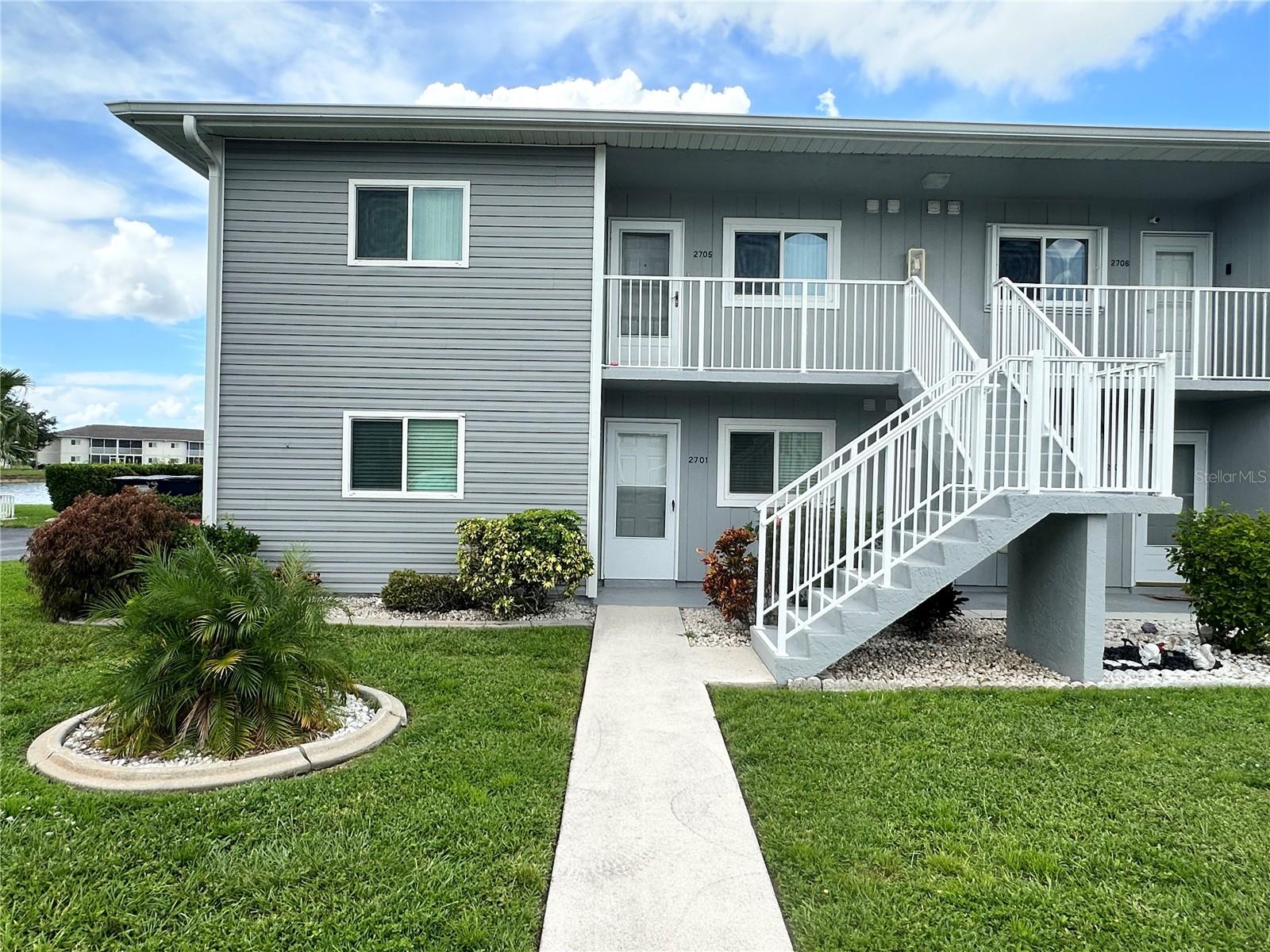 Enjoy the added privacy of living on the 2nd floor with spectacular lake views from several rooms and your screened in lanai! From the moment you step inside this charming 2-bedroom, 2-bathroom condo, sweeping Lake Views set a tone of effortless relaxation and it is NOT located in a flood zone. Designed for seamless entertaining, the bright, open kitchen features a central island and brand-new stainless steel appliances, paired with a dedicated laundry room offering full sized upgraded stainless washer and dryer units. Picturesque water views from the primary suite, living, dining, and kitchen areas, flowing naturally out to a screened lanai overlooking tranquil Lakefront scenery. Enjoy it all with complete peace of mind knowing that your home is located in a NO Flood Zone. Pack your suitcase and welcome to your turn-key Florida paradise! Located only 12 minutes to I-75 for easy commutes and fast access to traveling to the airport or other favorite Florida destinations. Seller is offering $1,000 towards buyer's closing costs.
