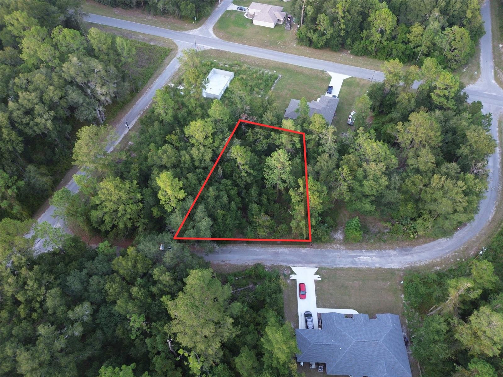 This approximately 0.35-acre vacant lot offers about 109' of frontage by 138' of depth with paved road access on Sequoia Loop Place in Silver Springs Shores Unit 44 in Ocklawaha. NO HOA. The property is zoned R-1 for single-family residential construction and is located in Flood Zone X, indicating minimal flood risk. The lot contains approximately 15,246 sq. ft. of land. A private well and septic system will be required. Electric utility/provider is Duke Energy. Power lines along road frontage. Enjoy convenient access to Lake Weir, Carney Island Recreation & Conservation Area with public boat ramps, and the Ocklawaha River, offering opportunities for boating, fishing, swimming, kayaking, hiking, and other outdoor recreation. Parcel ID: 9044-1572-07. For locating the property, you may use the nearby address 29 Sequoia Loop LN, Ocklawaha, FL 32179, or enter the following coordinates into Google Maps, Apple Maps, or Waze: 29.072414, -81.878379.