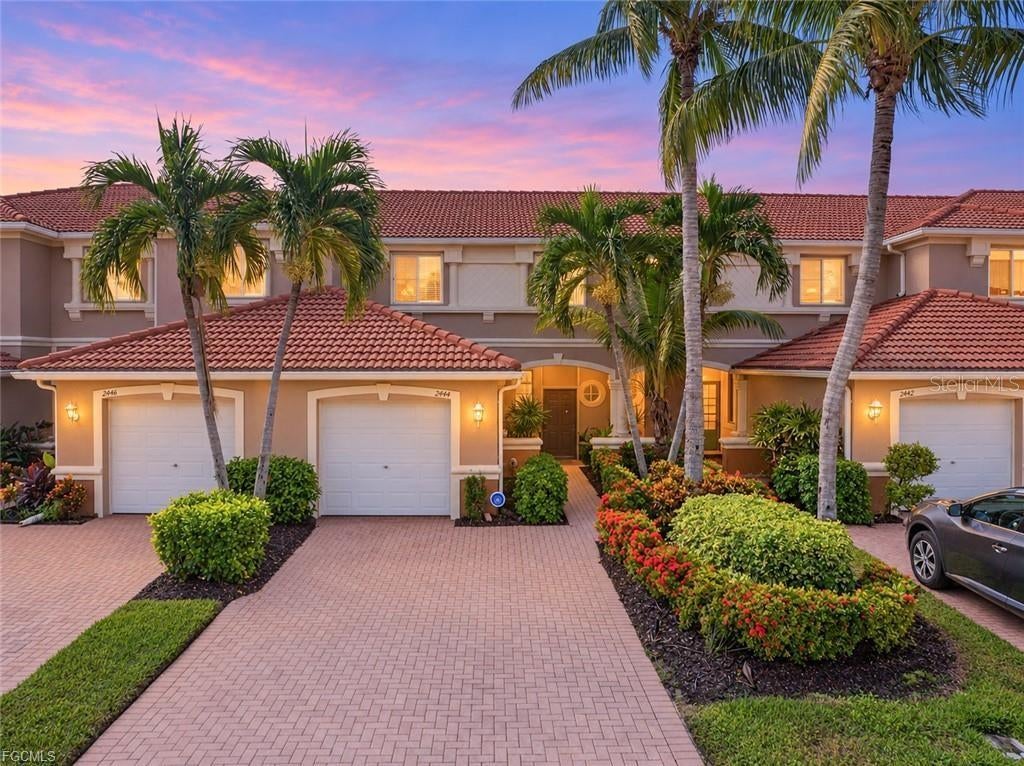 **LAKEFRONT LIVING IN GATED BELLA VIDA!** Welcome to this spacious 3-bedroom, 2.5-bath, two-story townhome offering 1,611 square feet of comfortable living space, a 1-car garage, and beautiful lake views! Located in the popular gated community of Bella Vida in Cape Coral, this home combines low-maintenance living with resort-style amenities and a convenient location. Step inside to discover a functional floor plan featuring spacious living and dining areas including an eat-in- kitchen and breakfast bar, tile flooring in the main lving areas and includes a convenient half bath downstairs, while upstairs you'll find 3 large bedrooms and two full bathrooms, including the primary suite with its own en-suite. Step outside to your screened lanai, where you can relax with your morning coffee, unwind after a long day, or simply enjoy the peaceful lake views and Florida lifestyle. The surrounding landscaping offers a tropical oasis and enhances the beauty of this amazing community. Accordion hurricane shutters on the windows provide added security and safety. This beautiful townhome qualifies for FHA and VA loans and IS NOT IN A FLOOD ZONE! Bella Vida offers an impressive selection of community amenities, including a resort-style swimming pool, clubhouse, fitness center, tennis courts, basketball courts, and more! Conveniently located in Northeast Cape Coral, you'll enjoy easy access to shopping, dining, schools, parks, and major roadways connecting to Fort Myers and surrounding Southwest Florida destinations. Best of all, lawncare is included in your monthly HOA fees for low maintenance living. Whether you're searching for a primary residence, seasonal retreat, or investment property, this lakefront townhome offers the perfect combination of space, location, and lifestyle. Schedule your private showing today!