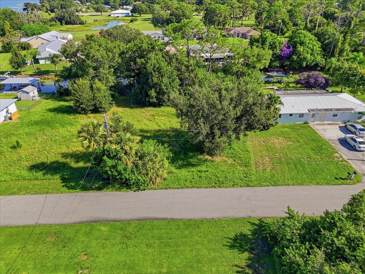 Imagine building your Florida getaway on this canal-front lot with direct access to beautiful Lake Grassy! Located at 117 Jasmine Court in Lake Placid, this approximately 0.23-acre homesite offers about 80 feet of waterfront and a convenient cul-de-sac location. The community boat ramp is nearby, making it easy to launch your boat, kayak, or personal watercraft and enjoy fishing, boating, watersports, and relaxing days on the lake. With no HOA and private well and septic systems, you’ll have the flexibility to create a full-time residence, seasonal retreat, or weekend escape designed around your lifestyle. Downtown Lake Placid is only minutes away, offering locally owned shops and restaurants, colorful historic murals, and the small-town charm that has made Lake Placid famous as the “Town of Murals” and the “Caladium Capital of the World.” Bring your builder and discover the possibilities of owning waterfront land in the heart of Florida’s lake country. Property Appraiser records identify the combined 80-by-125-foot parcel as R-2 zoning. Duplex construction may be permitted, property is subject to verification of zoning, lot combination, setbacks, septic feasibility, environmental requirements, and all applicable development approvals.