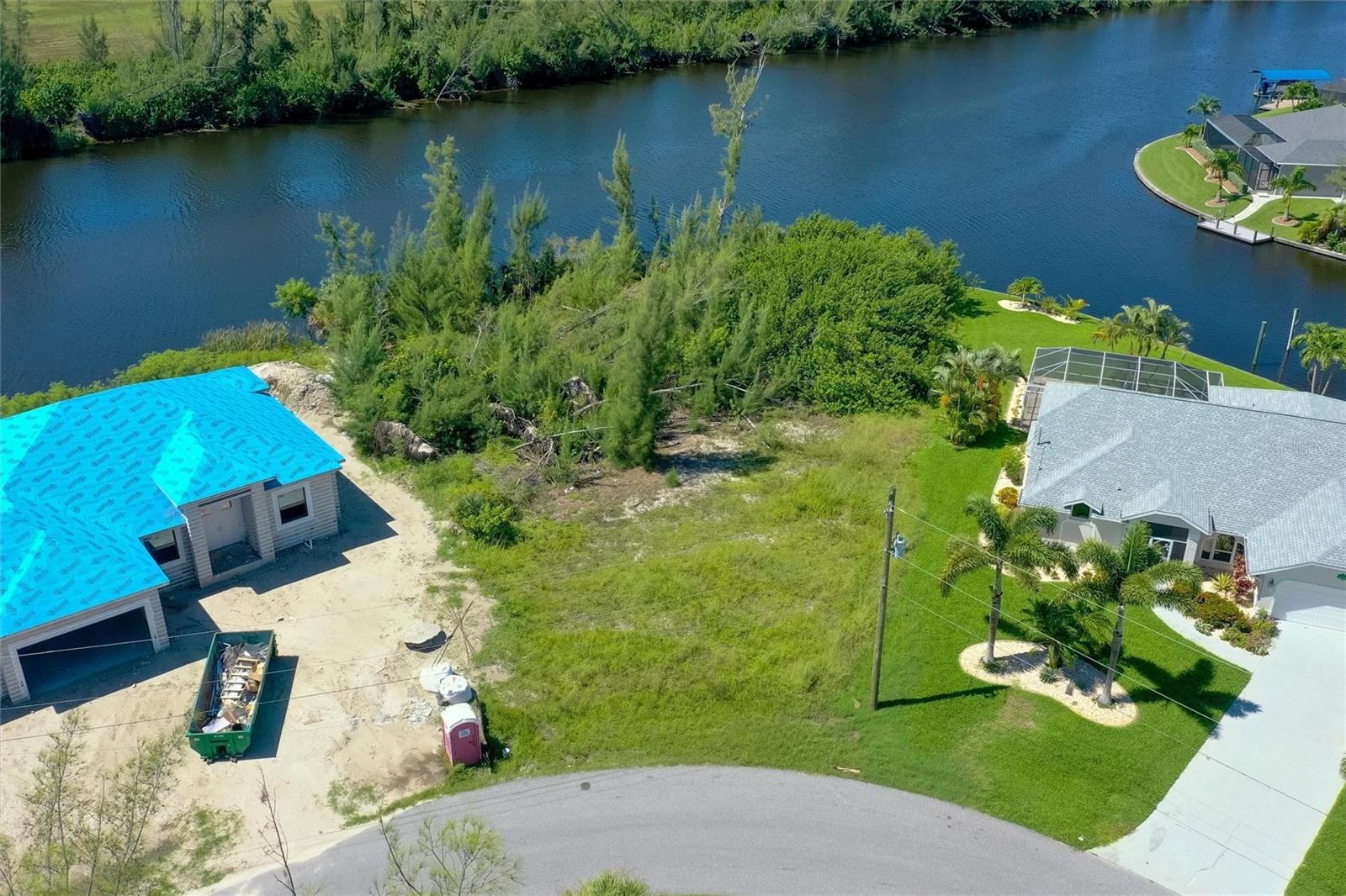 Beautiful Rare TIP Lot with 170 ft of concrete seawall in place.  Great area of new homes with Palm Tree lined street in one of the most desirable sections of South Gulf Cove!  Survey available.  Keep your boat in your backyard with a spectacular view!