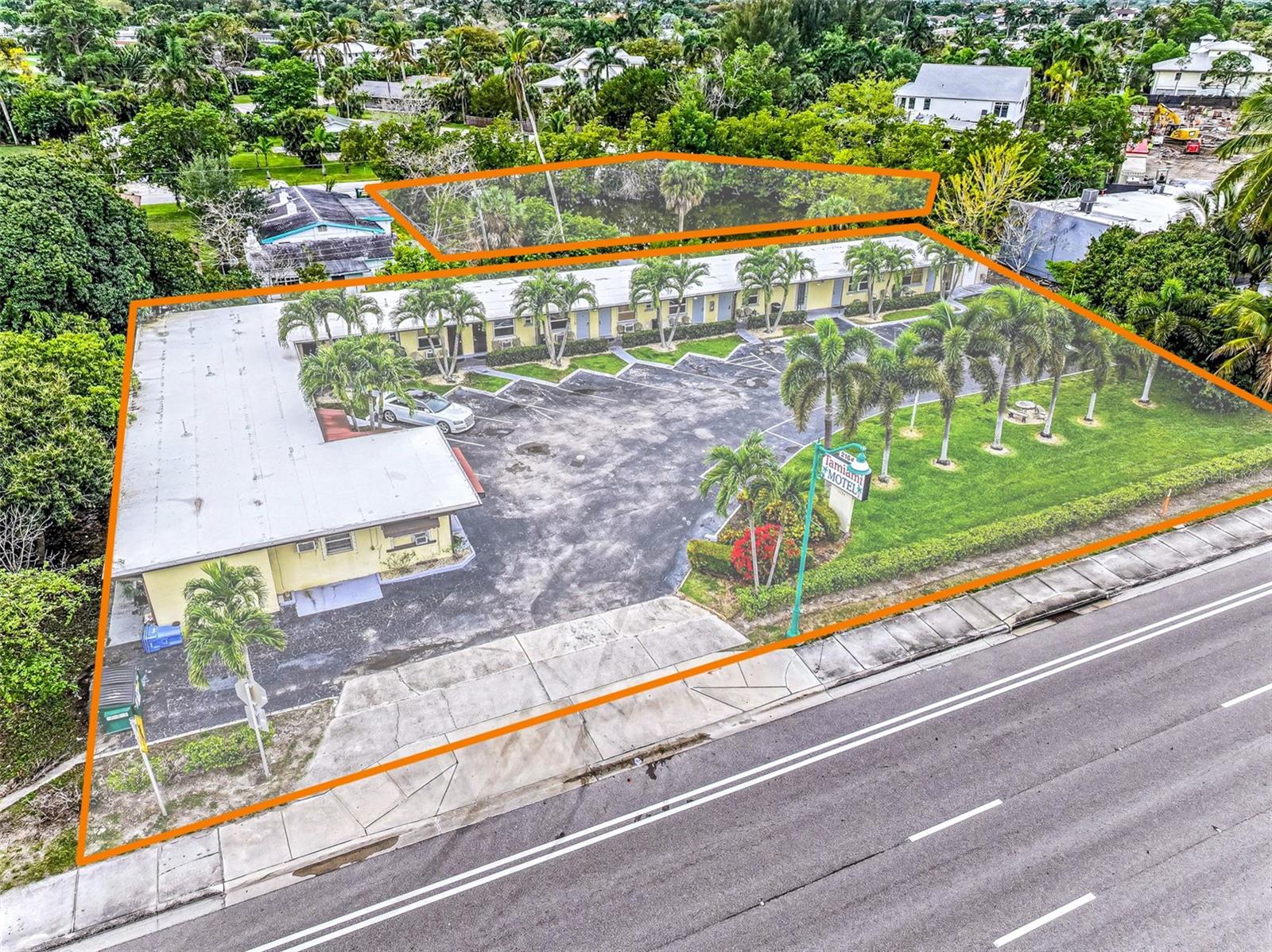 This 1.08 +/- Acre redevelopment site presents a unique opportunity to capitalize on the $350 million transformation underway in Naples, Florida.* Ideally positioned within East Naples, just minutes from 5th Avenue upscale shopping & dining district (Old Naples), the site will be surrounded by an emerging collection of luxury resorts and residential high-rises, including the JW Marriott Resort & Spa, Avra at Metropolitan Naples, Ascent at Metropolitan Naples, and the Halcyon Residences and Marina. 

The highly affluent surrounding area includes nearly 100,000 residents within a 5-mile radius, with an average household income exceeding $120,000 annually. This strong demographic profile continues to support a thriving retail environment and rapidly growing downtown district. Located just minutes from Naples’ renowned beaches, the site is well-positioned to serve both residents and visitors alike. 

Strategically situated just off the signalized intersection of Tamiami Trail (US-41) and Palm Street, the property benefits from excellent visibility and traffic counts of approximately 35,500 vehicles per day. The site currently consists of two parcels separated by a county-owned un-improved access ROW, which could potentially be vacated to create a contiguous 1.1+/-acre development opportunity. 

The site currently consists of a split residential and mixed-use zoning with potential for a unified mixed use zoning. This would allow for a wide range of development options, including luxury condominiums, a boutique hotel, or a high-end mixed-use project incorporating residential, office, and retail components. This offering presents a compelling opportunity to deliver a premier development in one of Naples’ fastest-growing corridors.