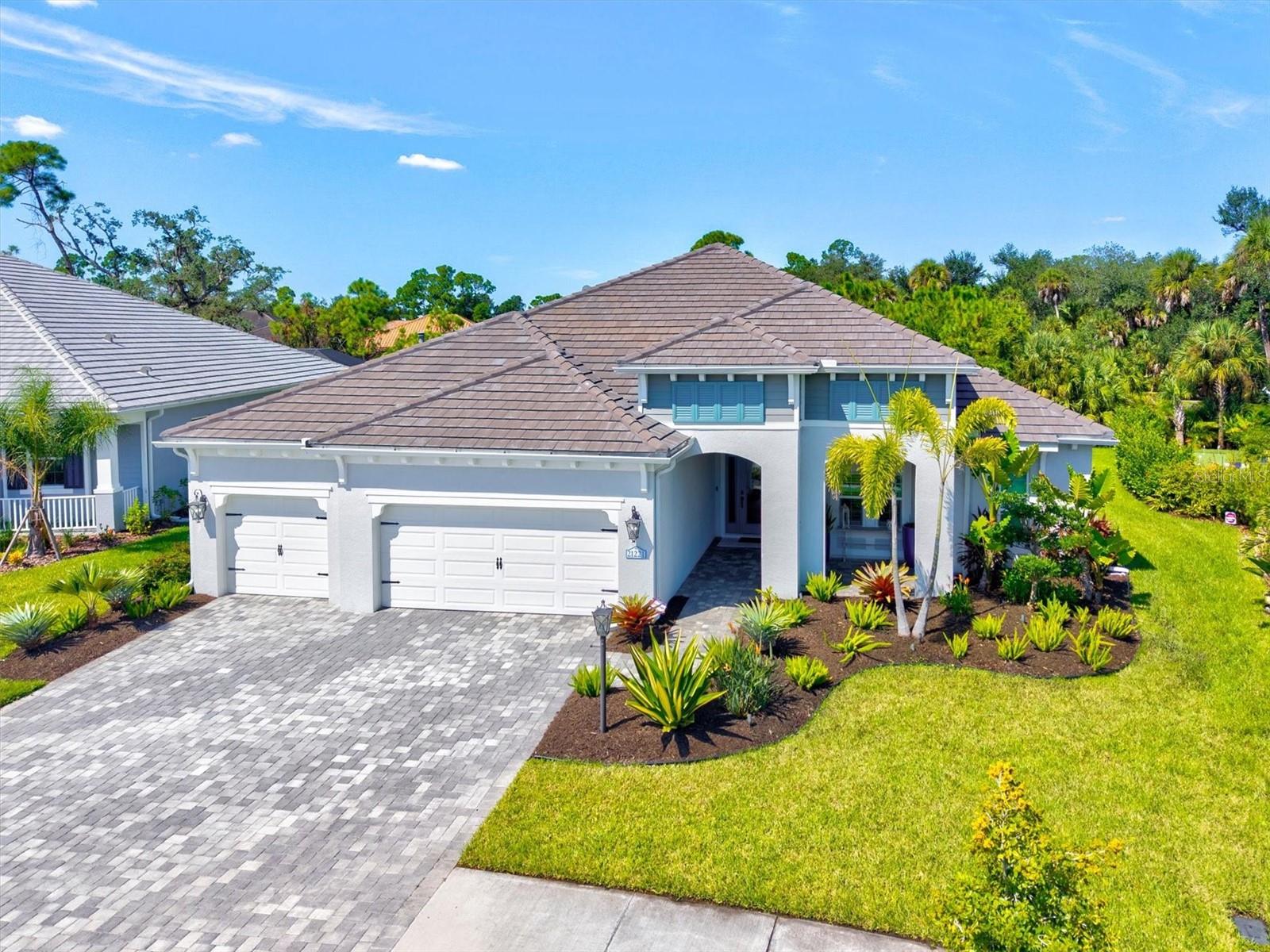 RARE KIAWAH OPPORTUNITY IN GRAND PALM! With the builder sold out, this beautifully upgraded nearly 3,000-square-foot home offers a floor plan that is increasingly difficult to find. Featuring 3 bedrooms, each with a walk-in closet, 3 full baths, a professionally designed den, bonus room with wet bar, and a true 3-car garage with epoxy flooring, this home combines exceptional space with thoughtful custom details throughout.
The glass front entry opens to a STRIKING WOOD CEILING on both the front and back covered porches, a detail that immediately sets the tone. The front den was professionally designed, creating a stylish office or retreat. Plantation shutters throughout, custom window treatments, impact glass, and NO CARPET provide style, durability, and easy Florida living.
At the heart of the home, the kitchen features a 5-burner gas cooktop, pull-out cabinet shelving, and a spacious walk-in pantry upgraded with wood ventilated shelving. A ZERO-CORNER SLIDER seamlessly opens the main living area to the lanai, creating an impressive indoor-outdoor connection and expanding the home's entertaining space. The bonus room with CUSTOM DRY BAR, including quartz countertop and wine cooler, offers additional space for entertaining, relaxing, or hosting guests.
Outdoor living is a standout feature of this home. The WEST-FACING backyard provides the perfect setting to enjoy Florida sunsets from your private pool and lanai. Privacy shades on the pool cage, custom outdoor lighting, hurricane shades, an outdoor kitchen, and a BUILT-IN FIREPLACE with remote control create a comfortable and private outdoor retreat designed for year-round enjoyment. A WHOLE-HOME GENERATOR provides additional peace of mind.
Grand Palm is known for its exceptional resort-style lifestyle, offering multiple pools, fitness facilities, pickleball and tennis courts, miles of walking and biking trails, dog parks, playgrounds, and a 39-acre Adventure Lake for kayaking and outdoor recreation.
With a 3-car garage, extensive upgrades, desirable west-facing outdoor living, and no other Kiawah currently on the market, 21221 Holmes Circle presents a rare opportunity to own one of Grand Palm's most spacious and sought-after floor plans.