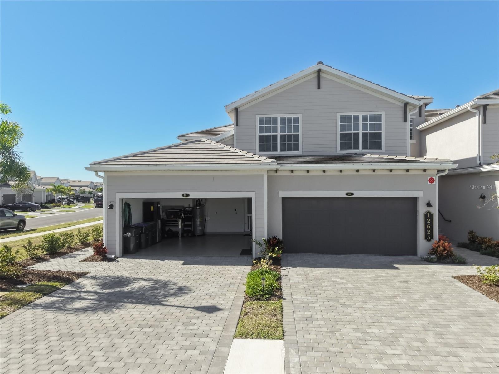Rare opportunity in Wellen Park Golf & Country Club. This coach home includes deeded golf memberships, something the builder is no longer offering with new construction. If golf is part of the lifestyle you want, this is one of the few remaining ways to get it.
The home is being sold turnkey furnished with a nearly new furniture package that would cost roughly $40,000 to replace. Everything is ready for you to move in and start enjoying the community. No shopping, no waiting on deliveries. You’ll also find thoughtful owner upgrades throughout, including hurricane impact glass windows and slider doors, an epoxy coated garage floor, plantation shutters, quality lighting and fixtures, and a fully equipped outdoor space with a portable propane grill. This is a first floor condo with no stairs. Inside, the open floor plan is bright and comfortable, with a well appointed kitchen, primary suite with dual walk in closets, and a private screened lanai. The 2 car garage gives you room for vehicles plus golf cart storage.
Outside the front door is the full Wellen Park Golf & Country Club experience. Play the championship Gordon Lewis designed course, then head to the resort style pools or the tiki bar. Work out in the fitness center, hit the tennis or pickleball courts, or join the active social calendar that the lifestyle director keeps full. The new clubhouse is under construction and scheduled for 2027, which will add even more dining and gathering space. Downtown Wellen, CoolToday Park (Braves spring training), and the Gulf beaches are all just minutes away, so you can be on the course in the morning and at the beach in the afternoon. It’s a true low maintenance, guard gated resort lifestyle.
Comparable coach homes don’t offer both deeded golf memberships and a nearly new furniture package. This one does. You’re getting the memberships the builder no longer includes with new construction, plus a move in ready home with quality furnishings already in place.
Schedule your showing and come see why this one stands out.