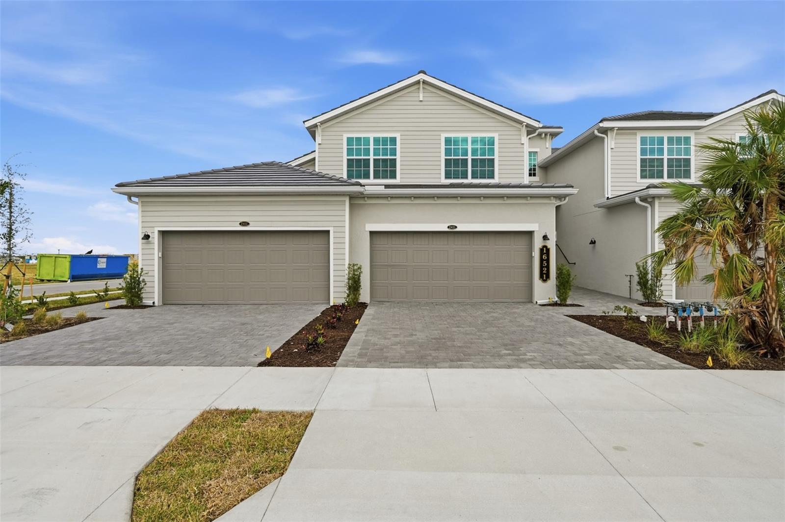 MOVE-IN READY!! Step inside this expansive 2,110-square-foot attached home, the largest in the Willowgreen at Babcock Ranch collection. The first floor is anchored by an impressive two-car garage with hurricane-rated door and keyless entry for added security. Upstairs, bright and open living spaces are designed for effortless entertaining, with a sleek kitchen that features quartz countertops, a spacious island and a full suite of brand-new stainless steel appliances—including a gas range, built-in microwave and French door refrigerator. Sliding doors lead to your private, screened patio retreat, perfect for gatherings or quiet nights outdoors. All three bedrooms, including the luxurious owner’s suite with a spa-inspired bath, are thoughtfully placed on this level, offering oversized walk-in closets and modern finishes throughout. Every detail, from ceramic tile flooring and LED recessed lighting to a Ring Video Doorbell Pro and a Honeywell Home T6 Pro Wifi smart thermostat, is crafted for comfort and convenience. Designer cabinetry, EPA WaterSense® fixtures and hurricane-impact windows add both style and peace of mind. Homes like this—with premium features, energy efficiency and a prime location moments from Founder’s Square—won’t last long. Prices, dimensions and features may vary and are subject to change. Photos are for illustrative purposes only.