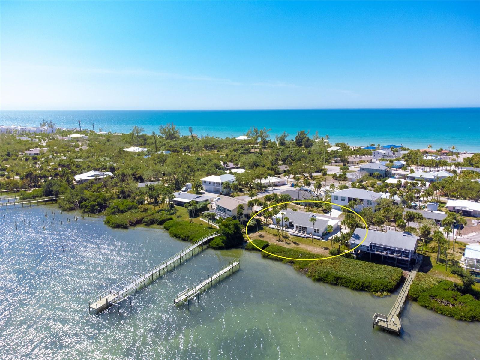 Experience the pinnacle of coastal luxury at 4087 Pelican Shores Circle, a masterpiece of modern design where every detail has been reimagined for the sophisticated buyer. This residence has undergone a complete, top-to-bottom HIGH-END RENOVATION by well know BAYFRONT BUILDERS, offering total peace of mind with a BRAND-NEW ROOF, new HVAC system, new electrical, new plumbing, and ALL-NEW IMPACT WINDOWS AND DOORS. Whether you are looking for a permanent family home, a vacation retreat, or a premier hosting venue, the layout is designed for effortless connection. The interior impresses with high ceilings, a mix of elegant decorative lighting and recessed lighting throughout, and luxury plank tile flooring that flows seamlessly through the open-concept living spaces.
The heart of the home is a chef’s dream, featuring QUARTZ COUNTERTOPS, custom soft-close wood cabinetry, and premium stainless steel appliances. The bathrooms are true sanctuaries, showcasing gorgeous high-end tile work and spa-like finishes. For those seeking flexibility, the floor plan features separate secondary suite-like area with its own walk-in closet and a private entrance through the garage, making it the perfect "home within a home" for multi-generational living or hosting long-term guests.
Outdoor living is redefined by a massive new composite deck that spans the entire rear of the property, putting you directly on the bay. Another huge perk is that there is plenty of room for your own custom pool! While you enjoy the community dock, the seller has already applied for private dock permit and obtained professional quote, paving the way for your own private slip. Beyond the bay, you also enjoy the best of the Gulf with DEEDED BEACH ACCESS AND ADDITIONAL BAY ACCESS WITH A COMMUNITY DOCK just moments away. From the impact-rated security to the luxury finishes, this home offers a rare opportunity to own a fully renovated waterfront sanctuary on where no expense has been spared. Living here means embracing a lifestyle where the hardest decision of your day is whether to watch the sunrise over the bay or the sunset over the Gulf. Manasota Key is a sanctuary of natural beauty, offering miles of uncrowded, pristine beaches famous for world-class shelling and prehistoric shark teeth. Spend your mornings exploring the winding canopy roads or kayaking through the mangroves of Stump Pass Beach State Park.
When evening falls, enjoy the island's vibrant social scene—just a short bike or golf cart ride away. From live music and waterfront dining at local staples like Lock ‘N Key or Sandbar Tiki & Grille to the charming shops and weekly farmer's markets on historic Dearborn Street just across the bridge, the Key offers a perfect blend of secluded tranquility and coastal convenience. Whether you are a boater, a beachcomber, or an epicurean, Manasota Key provides a lifestyle of unparalleled freedom and relaxation. Schedule your exclusive showing today and start living your best Florida Life!