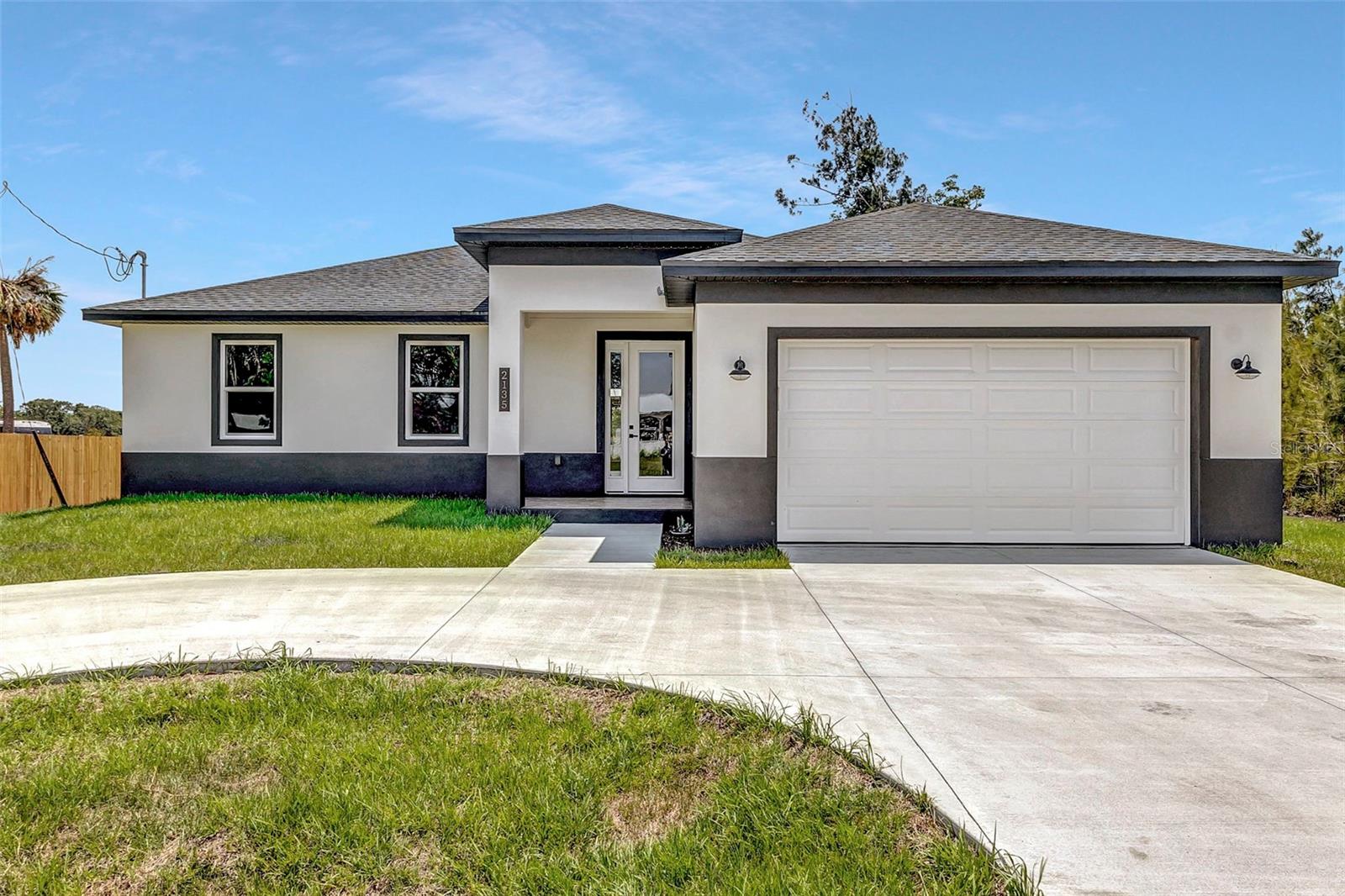Welcome home to this well-kept 4-bedroom, 2-bath custom home in Arcadia! Built with quality and care, this home has been lovingly lived in and is ready for its next owner. A circular driveway welcomes you and leads right up to the 2-car garage.

Step inside through a wide foyer that opens to a bright, open floor plan connecting the kitchen, living room, and dining room. Coffered ceilings, high ceilings in the bedrooms, 8-ft doors, and hurricane-impact windows add both style and peace of mind. Wood-look tile flows throughout the entire home for an easy-care, cohesive look.

The split floor plan offers privacy, with the primary suite on one side and three bedrooms and a full bath on the other. Every bedroom closet has a custom closet system. Thoughtful touches carry throughout the home, including farm-style sinks in the kitchen and both bathrooms and attractive light fixtures.

The kitchen is the heart of the home, featuring a large island with a farm-style sink and seating for bar stools, quartz countertops, white custom cabinets with soft-close drawers, and two pantries. Stainless steel appliances include the refrigerator, range, dishwasher, and microwave.

Just off the kitchen, the inside laundry room offers a closet and upper cabinets, and leads to the spacious 2-car garage with an epoxy-flake floor and a convenient side door.

Solid construction, smart design, and room to make it your own. Schedule your showing today!