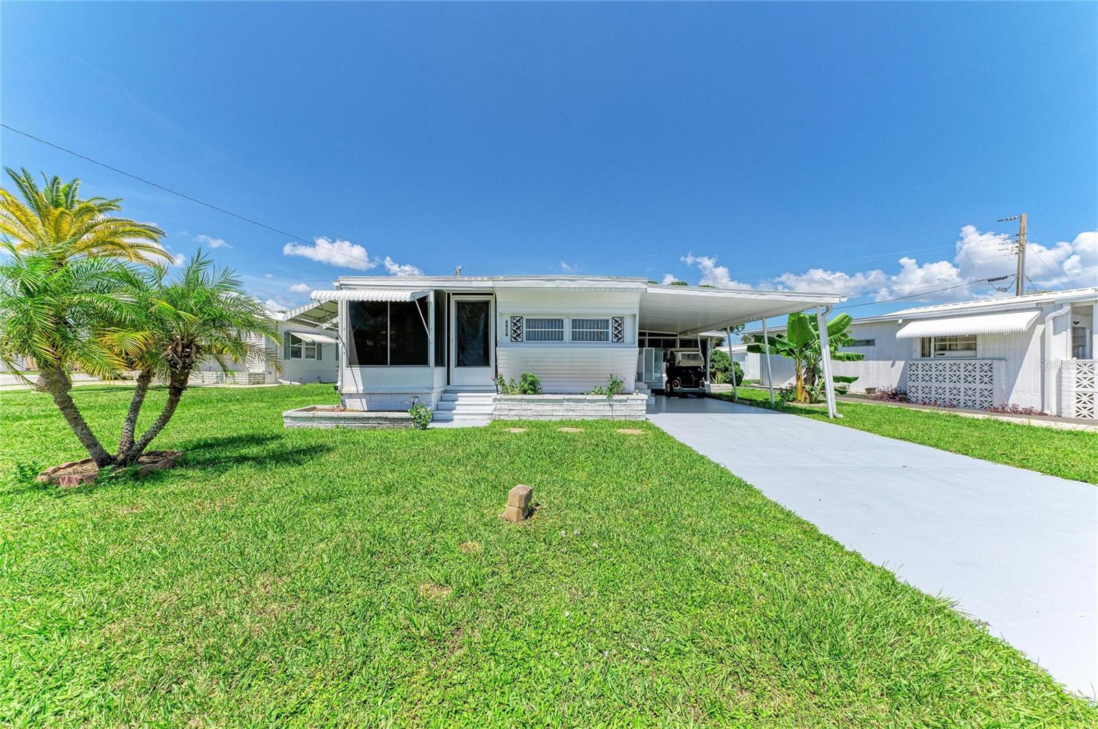 LAND OWNED. NO LOT RENT! THIS HOME OFFERS SUBSTANTIAL ADDITIONAL ENCLOSED SPACE! Beyond the recorded living area, you'll find an expansive Florida room with new windows, epoxy flooring and its own new wall A/C, plus an enclosed front porch/bonus room offering even more flexible-use space. LAND OWNED / NO LOT RENT! The Tri-Par community assessment of approximately $1,648 is collected ANNUALLY through the property tax bill. 4924 Oakland Hills Avenue is located in Tri-Par Estates, Sarasota’s popular 55+ golf cart-friendly community, the community fee is assessed annually through the property tax bill rather than collected as a monthly HOA payment. This clean and well-kept home offers an affordable opportunity to enjoy the Sarasota lifestyle with several important improvements already completed, including a newer roof installed in 2023, newly updated kitchen and baths, new central A/C(June 2025), new wall A/C in Florida room (Dec 2025) and luxury vinyl plank flooring throughout, no carpet. The home retains some of its original character while offering comfortable living spaces and a functional floor plan ready for a new owner to make their own. One of the home's standout features is the expansive Florida room, offering a generous amount of additional space for relaxing, entertaining, hobbies, or gathering with family and friends. With new windows, epoxy flooring and its own brand-new wall A/C unit(Dec 2025), this bright and comfortable space can be enjoyed throughout the year and adds wonderful versatility to the home. At the front of the home, an enclosed porch creates an additional bonus room, providing even more flexible space that could serve as a sitting area, home office, reading room, hobby space, or simply a welcoming place to enjoy your morning coffee. Another great advantage is the home's convenient location within Tri-Par Estates. Community amenities are just a short walking distance away and include a heated swimming pool and spa, pickleball and shuffleboard courts, fitness center, clubhouse, library, horseshoes, and a full calendar of social activities, clubs, dances, and community events. Tri-Par Estates offers exceptional value for residents. The community's central Sarasota location puts you within easy reach of downtown Sarasota (10 min drive), Sarasota-Bradenton International Airport (5 min drive), UTC shopping and dining (15 min drive) , golf, waterfront restaurants, arts and entertainment, shopping centers , grocery stores, medical facilities and the beautiful Gulf Coast beaches, all within 20 min drive. Whether you're looking for a full-time Florida residence, a seasonal getaway, or a home you can personalize over time, 4924 Oakland Hills Avenue offers an increasingly hard-to-find combination of land ownership, generous additional living spaces, resort-like community amenities, and a convenient Sarasota location. Come see the possibilities and discover the lifestyle Tri-Par Estates has to offer. MOTIVATED SELLER. BRING ALL OFFERS.
