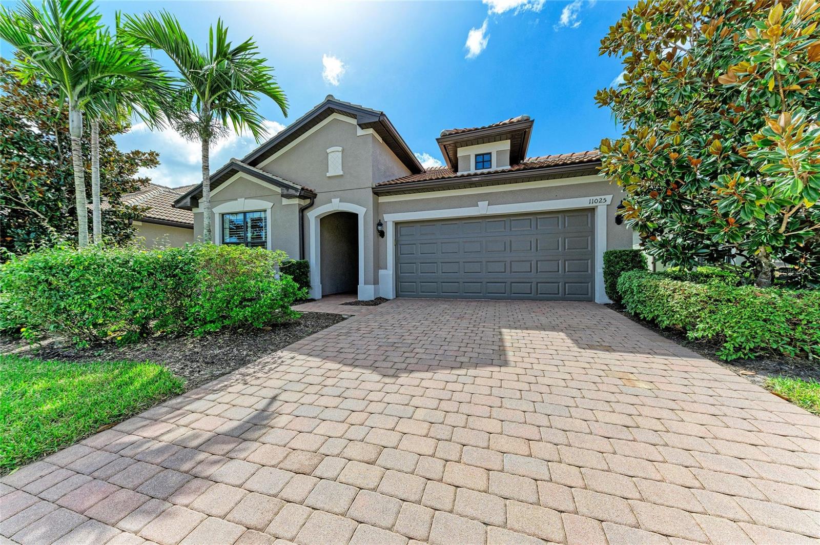 Discover the ease of Florida living in Sandhill Preserve, a gated, resort-style community in Sarasota’s sought-after Palmer Ranch. Beautifully positioned with a private backyard, this lovely two-bedroom, two-bath home offers inviting spaces, thoughtful upgrades, and a den easily converted to a 3rd bedroom. A glass-front entry door welcomes you inside, where 18-inch ceramic tile and plantation shutters add to the home’s bright, inviting feel. The open kitchen and family room provide a natural gathering place, whether you’re hosting friends or enjoying a quiet evening at home. The kitchen features a large island, stainless steel appliances, updated lighting, and a natural gas range.
Centrally located French doors open to the den, offering a flexible space for working from home, reading, or pursuing your favorite hobbies. The primary suite features a generous bathroom with a large shower, dual vanities, and a walk-in closet. Additional conveniences include a spacious laundry room with a large storage closet and a clean two-car garage with additional space for your bins. 
Step outside to your covered, screened in lanai, overlooking the private retreat. Imagine starting your morning with coffee outdoors, enjoying dinner, or gathering with friends in this peacful setting. Sandhill Preserve offers a wonderful social lifestyle. Residents enjoy a clubhouse, heated pool and spa, fitness center, tennis courts, fire pit, outdoor Barefoot Bar and grilling area, plus a variety of activities and events included on the social calendar. Lawn care is included in the HOA fee, giving you more time to relax at home. Enjoy the beauty of clean, open streetscapes with underground utilities that enhance the charm of the community while offering added peace of mind during storm season. With Publix close by and Sarasota’s dining, shopping, recreation, entertainment, and Gulf Coast beaches only minutes away, there’s always something to enjoy. Come experience the comfort, community, and lifestyle that make this home so special!