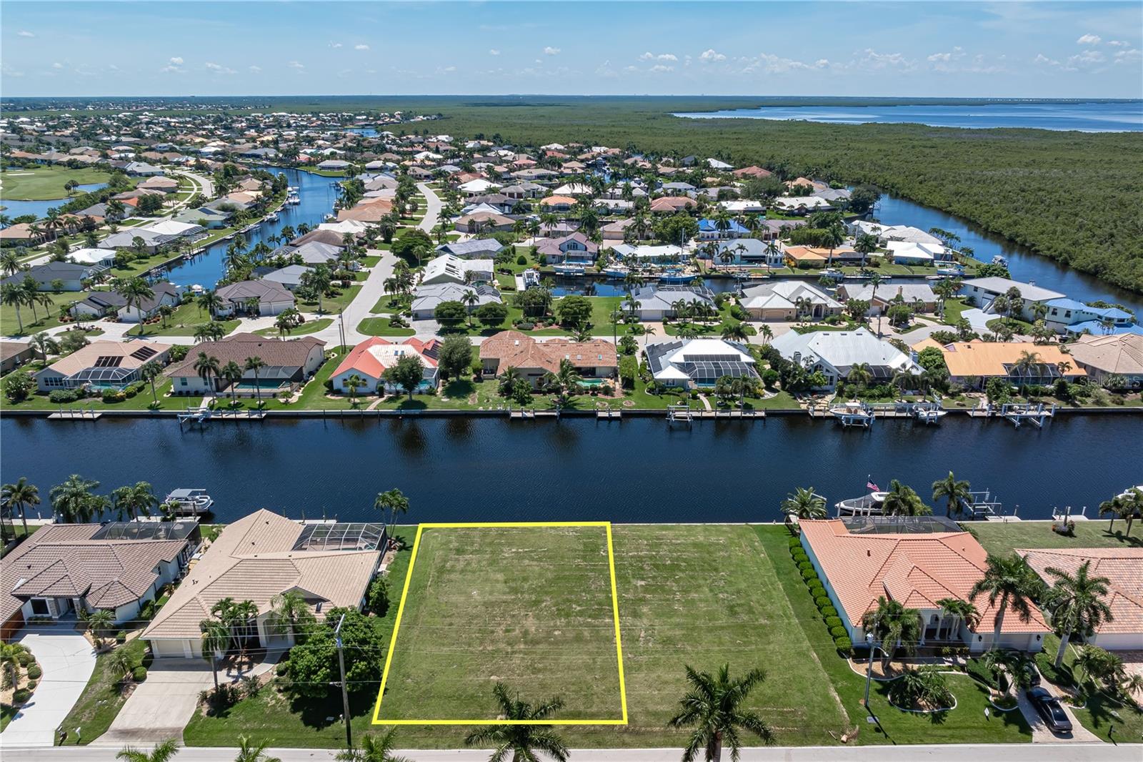 PGI WATERFRONT LOT W/SAILBOAT ACCESS + ADJACENT LOT ALSO AVAILABLE! Build your dream home on this vacant, waterfront lot in Punta Gorda Isles & start enjoying the Florida waterfront lifestyle. Lot dimensions are 80x120x80x120 w/80 FT OF WATER FRONTAGE plus public water & sewer available. Boaters have TWO OPTIONS for reaching Charlotte Harbor - head out through Buckley's Pass or enjoy a leisurely cruise around the perimeter canal to Ponce Outlet. From there, head out to Charlotte Harbor & beyond to enjoy some of the best fishing & boating SW Florida has to offer. Property is surrounded by a mix of established homes & newer, custom-built homes. Add your own custom home to the neighborhood & design it around the lifestyle you've been dreaming about - complete w/the outdoor living space, pool & dock setup that works for you. Ready to build? Start planning your waterfront home today. Not ready yet? BUY NOW & HOLD FOR THE FUTURE as vacant waterfront lots in Punta Gorda Isles become increasingly difficult to find. WANT MORE SPACE, PRIVACY OR WATER FRONTAGE? The ADJACENT WATERFRONT LOT (#12) IS AVAILABLE FOR SALE SEPARATELY. Purchase both properties to create a rare double lot w/approximately 160 FT OF WATER FRONTAGE. Build across both lots for a larger home OR build on one & keep the neighboring lot open for additional privacy, extra waterfront space & a separate investment for the future. Owning both gives you the flexibility to decide what works best for you now while preserving options down the road. Located near St Andrews South Golf Club, this property puts two of Punta Gorda's favorite pastimes within easy reach. Enjoy a morning round of golf before returning home to head out on the boat for an afternoon on Charlotte Harbor. Punta Gorda Isles also offers miles of sidewalks connecting you to nearby parks, Fishermen's Village & historic downtown Punta Gorda. This property offers plenty of possibilities. Own your piece of paradise today!