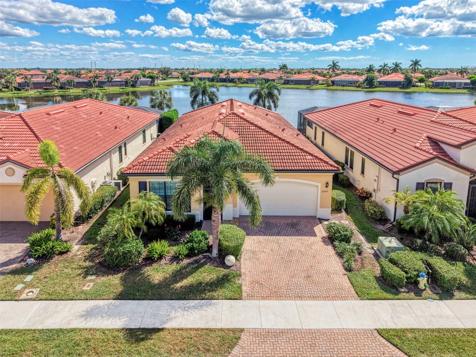 Luxury Waterfront Living in Sarasota National
Discover the epitome of luxury living in this exceptional waterfront residence, nestled within the prestigious, gated golf course community of Sarasota National. Showcasing the highly sought-after WCI Key Largo model, this beautifully appointed home offers an extraordinary blend of sophisticated design, resort-style amenities, and the relaxed elegance of Florida living.
Featuring 3 bedrooms, 3½ bathrooms, plus a den and Private sparkling saltwater pool and spa this thoughtfully designed residence welcomes you with soaring 10-foot ceilings, impressive 8-foot doors, a dramatic tray ceiling in the great room that adds architectural elegance and a sense of grandeur. Plantation shutters, designer paint selections, and elegant porcelain tile flooring throughout create a refined, timeless aesthetic, while new carpeting in the bedrooms adds an inviting touch of comfort.
Elegant entry with arched architecture leads to two en-suite guest rooms and a separate den. The gourmet kitchen is a chef's dream, featuring gorgeous granite counters, striking subway backsplash, stainless appliances, a spacious walk-in pantry, and a convenient breakfast bar with designer lighting-perfect for casual dining and entertaining.
The primary suite offers a peaceful private retreat, complete with a comfortable sitting area, elegant tray ceilings and beautiful Waterview's. A generous walk-in closet provides exceptional storage, while the spa-inspired en-suite bath features a dual-sink vanity with sleek finishes and a stunning glass-enclosed Roman shower.
Step outside to your own private outdoor oasis, where a sparkling saltwater pool and spa overlook tranquil waterfront views. Entertain in style with the fully equipped outdoor summer kitchen, perfect for al fresco dining, sunset cocktails, and unforgettable gatherings with family and friends.
Life at Sarasota National is more than a home—it's a lifestyle. Golf membership is included at the renovated Gordon B. Lewis designer course, offering access to the community's exceptional golf experience. Residents also enjoy two on-site restaurants, a lively poolside tiki bar, and an array of resort-style amenities; a zero-entry heated swimming pool, lap pool, tennis and pickleball courts, bocce ball,  fitness center with classes, and a variety of social activities and clubs designed to elevate everyday living.
Conveniently located near shopping, dining, and the beautiful Gulf Coast beaches.
Whether you're seeking an elegant year-round residence, a luxurious seasonal retreat, or the ultimate Florida lifestyle, this remarkable waterfront home delivers the perfect balance of comfort, sophistication, and leisure.
Embrace the lifestyle and make Sarasota National home.