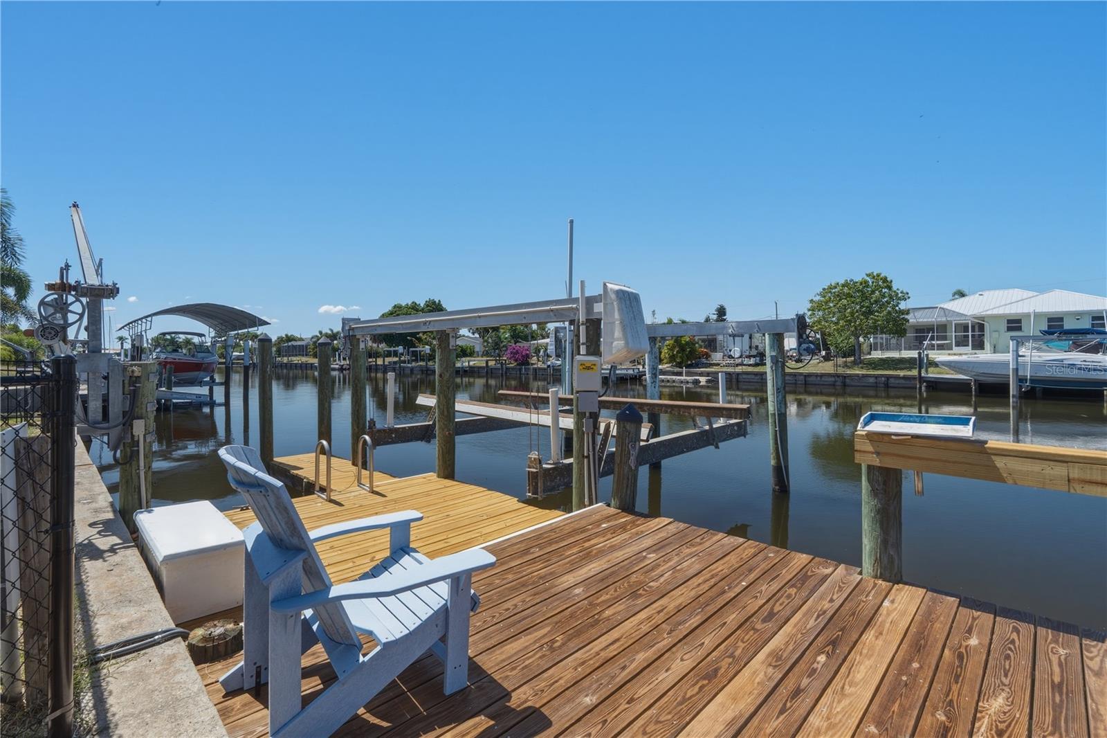 INCOMING PRODUCING TURNKEY AIRBNB! Ready to go, property manager in place, cleaning crew set up, just get the keys and start making money. 
Imagine yourself waking up to peaceful waterfront views, sipping your morning coffee by the pool, and spending your afternoons cruising the beautiful waters of Charlotte Harbor. 

Welcome to 21277 Edgewater Drive, where every day feels like a Florida vacation! 

This beautifully updated 3-bedroom, 2-bathroom waterfront retreat offers 1,718 square feet of living space and direct boating access to Charlotte Harbor with NO FIXED BRIDGES! Boating enthusiasts will love the PRIVATE DOCK, 16,000-POUND BOAT LIFT, and 80-FOOT CONCRETE SEAWALL. 

Step inside to discover an inviting open layout and a spacious kitchen featuring granite countertops, stainless steel appliances, and gas cooking. The true highlight is your PRIVATE BACKYARD OASIS! Spend sunny afternoons floating in the HEATED POOL, entertaining under the screened lanai, or relaxing by the water. 

Recent upgrades include a RESURFACED POOL with NEW COPING, freshly painted interior, updated bathrooms, modern lighting, new window coverings, a FENCED IN backyard, and beautifully refreshed landscaping. 

The rebuilt and stained deck and renovated shed/game room offer additional spaces for entertaining and relaxation.

Additional features include a 2022 ROOF, 2022 POOL HEATER, Ring security cameras, keyless entry, and a two-car garage. 

Conveniently located near shopping, dining, parks, and entertainment, this home captures the very best of Southwest Florida living. Whether you're boating, lounging poolside, or hosting unforgettable gatherings, this isn't just a home—IT'S THE FLORIDA LIFESTYLE YOU'VE BEEN DREAMING OF! Schedule your private showing today