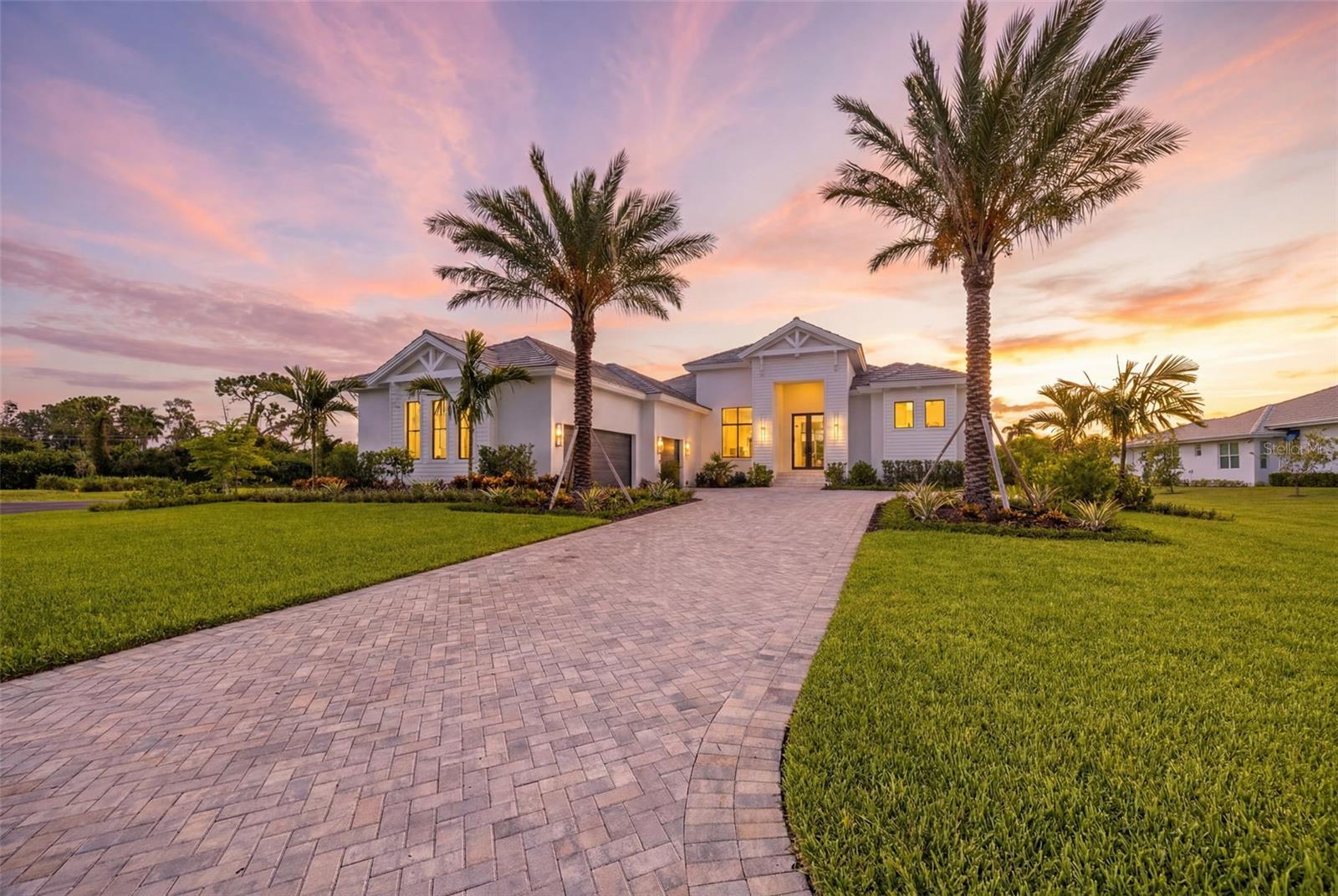 Stunning New Construction in Gated Devonwood, Fort Myers. Welcome to this exquisite new construction estate in the exclusive, gated community of Devonwood. Built in 2025, this 4-bedroom + den, 6-bath (4 full, 2 half) masterpiece offers 3,768 sq ft of architecturally designed living space (6,455 sq ft total) on a private .91 acre oversized homesite. Step through impact-resistant, picture, and transom windows into a light-filled great room floor plan with soaring beamed ceilings, wide-plank wood flooring, and a striking mix of designer finishes throughout. The chef's kitchen is a showstopper, featuring a massive waterfall-edge island, custom cabinetry, gas cooktop, and a walk-in pantry, all flowing seamlessly into the dining and living areas for effortless entertaining. The primary suite is a private retreat with dual sinks, a separate soaking tub, walk-in shower, and generous walk-in closet. A den/study and screened lanai/porch round out the thoughtful layout, while a 3-car garage and paved driveway offer ample parking. Outdoor living shines with a heated, saltwater pool and spa, outdoor kitchen, fireplace, and shower, all set beneath a screened lanai overlooking the beautifully landscaped grounds. Additional highlights include impact-resistant doors, storm shutters, a whole-home generator-ready propane system, tankless water heater, and top-tier security features. Devonwood residents enjoy an amenities such as: community boat dock, boat ramp, and Gulf access, tennis courts, basketball, picnic and BBQ area, all just minutes from Fort Myers' best dining, shopping, and beaches. A rare opportunity to own a brand-new estate in one of Fort Myers' most coveted gated communities.