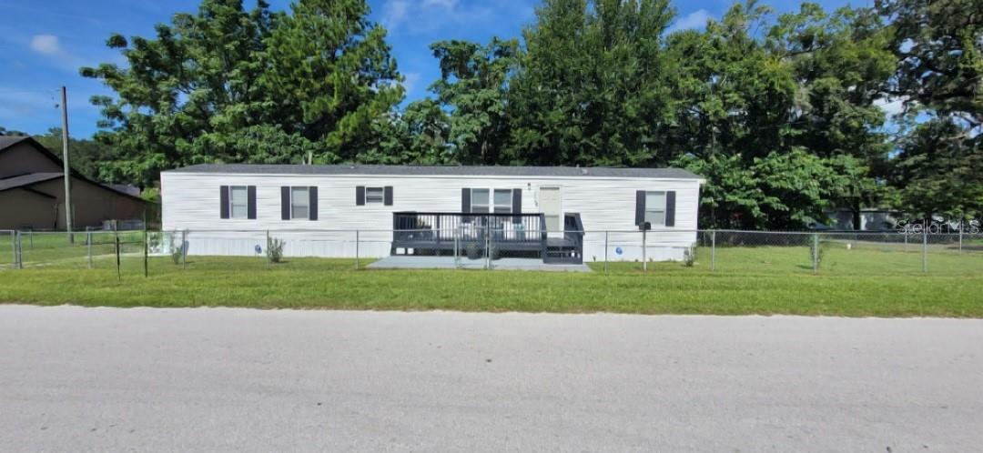 SELLERS ARE MOYIVATED!!. Welcome to Williston in beautiful Levy County, Florida! This well-maintained 2-beds, 2-baths CORNER LOT home offers comfortable living with an open floor plan suitable for everyday living and entertaining. Major updates have already been completed for peace of mind, including a newer roof, a newer AC system and water heater in 2021. The house is freshly painted, has new laminate flooring installed about a month ago and new skirting around the house.. New vapor barrier and insulation under the house. The Home is equipped with ceiling fans throughout. All appliances are included, making this home truly move-in ready in the neighborhood. The primary suite features a walk-in closet, double vanity sinks, and an enclosed shower. One of the best features of this property is the freedom it offers with NO HOA and NO CDD fees. Enjoy homeownership without restrictive association rules or additional monthly expenses. The property features a fully fenced yard, and plenty of outdoor space for pets, gardening, or recreation. A large storage building located behind the home provides ample space for tools, hobbies, lawn equipment, or additional storage needs.
Location! Location! Location! This house is conveniently located in Levy County, right on the border of Aluchua county.  About 5 minutes from downtown Williston, 20-25 minutes NW of Ocala and about 25 minutes south of Gainsville. Pinehurst residents enjoy easy access, 5-10 minutes, to shopping, dining, medical facilities, schools, and outdoor recreation. Nature lovers will appreciate the proximity to the Gulf Coast, local springs, fishing, boating, kayaking, and the renowned Cedar Key area. The property is also within minutes of popular retailers, grocery stores, restaurants, pharmacies, and healthcare services. Whether you're looking for a full-time residence, seasonal retreat, or investment opportunity, this property offers small-town charm with convenient access to everyday amenities. 
Don't miss your opportunity to own this move-in-ready home in one of Levy County's peaceful communities!
Room sizes are estimates and are to be verified by the buyer and/or buyer’s agent.