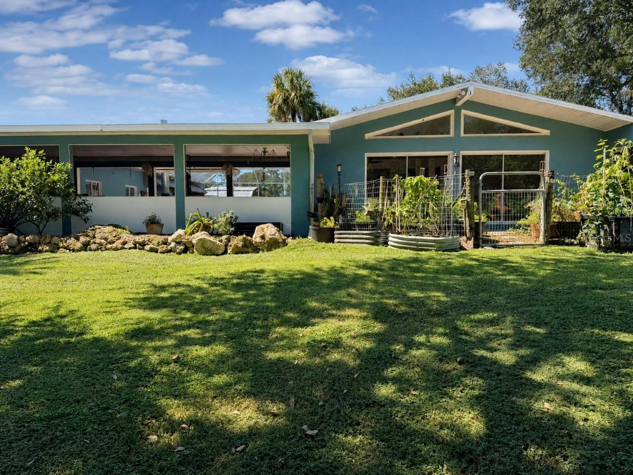 Virtually Staged. Rare working hobby farm on 3+ acres of agriculturally zoned land in North Port Estates! Enjoy privacy, freedom, and the opportunity to embrace a true farm-to-table lifestyle. With no HOA or deed restrictions, there is room to raise animals, grow your own food, and store boats, RVs, tractors, and recreational equipment. The established farm currently includes 9 sheep, 2 cows, a pot-belly pig, geese, ducks, 20+ turkeys, and approximately 60 chickens. At the current asking price, the livestock and poultry are included!

The spacious 3-bedroom, 2-bath pool home features an open floor plan, vaulted ceilings, abundant natural light, and multiple sliders leading to a large screened lanai with heated pool and spa. Enjoy a fire pit, well-equipped kitchen, impressive 6-car drive-through garage, and separate 10x12 shed.

Recent improvements include a new roof and AC (2023), water heater and pool resurfacing (2021), updated countertops (2021), and a newer washer and dryer. Conveniently located near I-75, Tamiami Trail, shopping, dining, medical facilities, golf, Gulf beaches, Atlanta Braves Spring Training, and multiple airports. Bring your vision and enjoy a truly unique Florida farm-to-table lifestyle!   Interior and lanai photos have been virtually staged for illustrative purposes only. Furnishings and décor shown have been digitally added and are not included with the property.