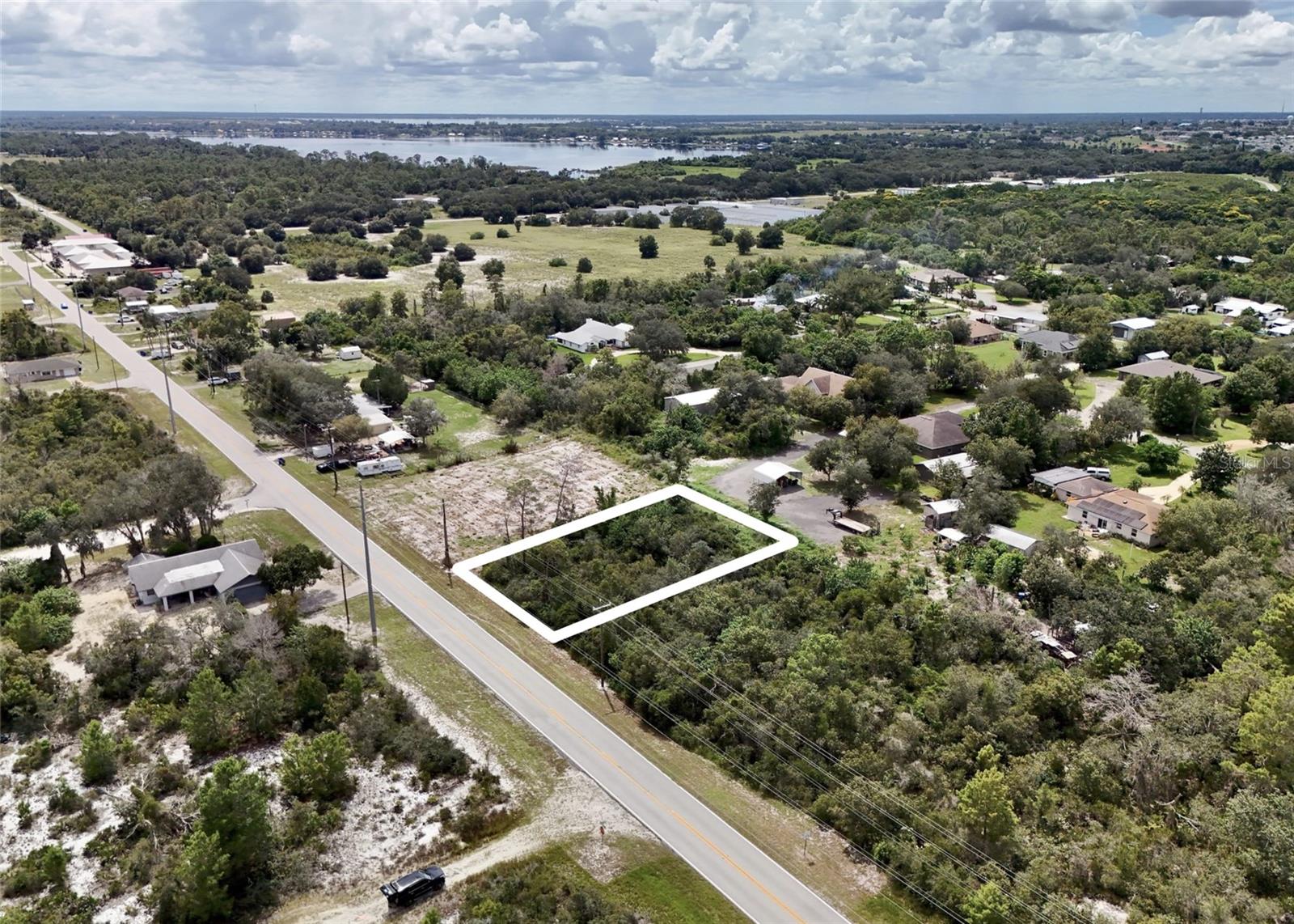 Prime residential 0.26 acre lot opportunity in Lake Placid, Highlands County, located at 204 Hallmark Ave (PID: C20363002000100240). 

Situated in a desirable residential area, this property offers convenient access to Windy Point Park (approximately 1.12 miles), Publix (1.65 miles) and Interlake Academy (1.81 miles). The lot is located in Flood Zone X, a low-risk area outside the 100-year and 500-year floodplains, with no wetlands present, allowing for full lot utilization without environmental buffers or mitigation requirements. 

Zoned R1 Single Family Residential District, the property supports low-density residential use, including single-family detached homes by right. Modular/manufactured homes and Accessory Dwelling Units (ADUs) may be allowed subject to applicable building codes, conditions, and approvals. Duplexes, townhomes, multifamily development, and mobile home communities are generally prohibited without rezoning. Buyer should verify all zoning, setbacks, utility availability, and development requirements with the Highlands County Planning Department. 

The property is available for a self-guided tour. Subleasing is not permitted. This lot is not available for rent or lease.