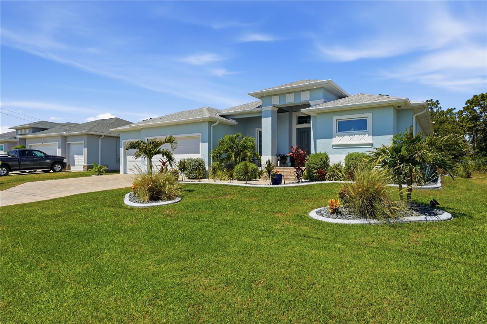 Luxury, Location, and Lifestyle converge in this beautifully upgraded 2024 Custom-Built Pool Home in the sought-after Golf Course Community of Rotonda West.

Offering 3 Spacious Bedrooms, 2 Full Bathrooms, and 2,170 Square Feet of impeccably designed living space, this exceptional residence showcases Modern Elegance, Thoughtful Upgrades, and the very best of Florida Living. From the moment you arrive, you'll be captivated by the home's impressive Curb Appeal, enhanced by Abundant Professional Landscaping that creates a lush tropical setting and a welcoming first impression.

Step inside to discover an Open-Concept Floor Plan highlighted by Soaring Vaulted Ceilings, Elegant Tray Ceiling Details, and Wood-Look Porcelain Plank Tile Flooring throughout. The Expansive Great Room flows seamlessly into the Formal Dining Area and a Chef-Inspired Kitchen featuring Quartz Countertops, Solid Wood Cabinetry with select Glass-Front Doors and Open Shelving, Premium Stainless Steel BESPOKE Appliances, and a Spacious Walk-In Pantry. Designed for both Everyday Comfort and Effortless Entertaining, this space serves as the heart of the home.

The Luxurious Primary Suite offers a Private Retreat with direct access to the Lanai through Sliding Glass Doors, Dual Walk-In Closets, and a Spa-Inspired En-Suite Bath complete with Dual Vanities and a Custom-Tiled Walk-In Shower featuring Built-In Seating and Multiple Shower Heads.

A desirable Split-Bedroom Floor Plan provides privacy for family and guests, with Two Additional Bedrooms and a Well-Appointed Guest Bath located on the opposite side of the home. The Guest Bath also offers convenient access to the Lanai and Pool Area.

The Upgraded Garage is equally impressive, featuring Durable Epoxy Flooring and Custom Built-In Storage Solutions, providing exceptional organization and versatility for vehicles, tools, recreational equipment, and hobbies.

Outdoor Living takes center stage with an Expansive Covered Lanai and Stunning In-Ground Pool, creating the perfect setting for relaxing, entertaining, and enjoying Florida's year-round sunshine. Surrounded by Mature Landscaping and thoughtfully designed outdoor spaces, this Private Backyard Oasis embodies the Indoor-Outdoor Lifestyle that makes Southwest Florida so desirable.

Additional features include Impact-Rated Windows and Doors for enhanced Storm Protection, Security, and Energy Efficiency, as well as Central Air Conditioning and Electric Heating for year-round comfort.

Ideally situated in the heart of Rotonda West, residents enjoy the benefits of a Premier Golf Course Community without the burden of High HOA Fees. Multiple Championship Golf Courses are just minutes away, while nearby Walking Trails, Parks, Boating, Fishing, and Nature Preserves provide endless opportunities for recreation. World-Renowned Gulf Coast destinations, including Boca Grande and Manasota Key, are only a short drive away, offering Pristine Beaches, Exceptional Fishing, Waterfront Dining, and Spectacular Sunset Views.