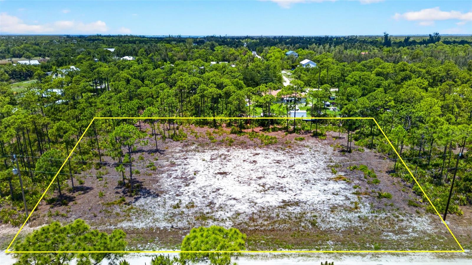 Rare Double-Lot Oasis! Cleared 1-Acre Parcel in Desirable Bokeelia – Ready for Your Dream Island Home! Escape to the tranquil paradise of Pine Island and build your ultimate retreat on this massive 1-acre cleared lot. While most standard parcels in the peaceful Kreamer’s Avocado subdivision are just a half-acre, this rare property offers double the size, giving you an incredible whole acre of pure potential. The grueling and expensive site preparation is already done for you. The lot has been meticulously cleared, and stumps have been completely removed, saving you thousands of dollars in upfront excavation costs, heavy machinery rentals, and months of waiting on contractors. It is a clean slate, 100% ready for your architectural blueprints. Situated on the highly sought-after north end of Pine Island in Bokeelia, this location perfectly balances secluded "Old Florida" charm with convenient modern amenities. Enjoy a relaxed, golf-cart-friendly island lifestyle surrounded by lush palm nurseries, tropical fruit groves, and vibrant local art culture. You are just minutes away from world-class tarpon fishing, multiple local marinas, public boat ramps, local boutiques and stunning waterfront dining landmarks like the historic Tarpon Lodge. When you need a taste of the city, Cape Coral is just a short, scenic 20-minute drive away. Electricity and water available in the immediate area. No HOA and the property is NOT in a flood zone!