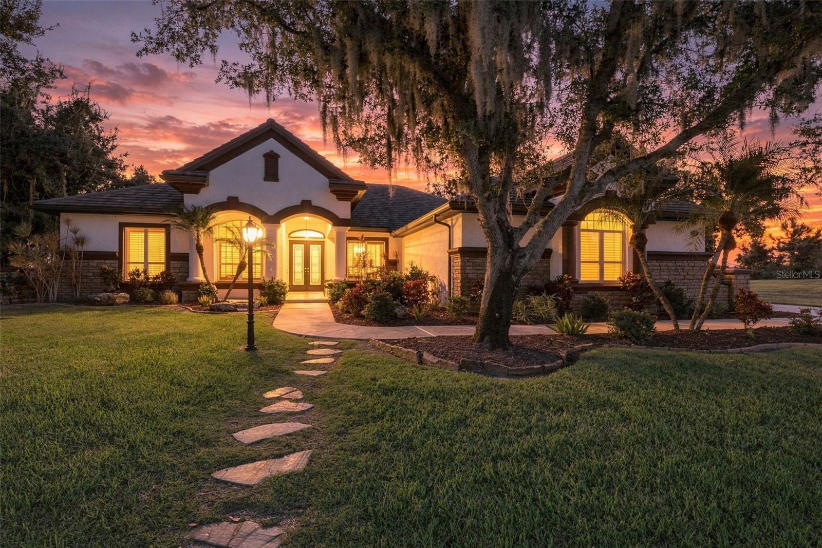 A Tuscan-Inspired Lakefront Estate on Over Half an Acre.  Behind the gates of Serenoa Lakes, at the end of a private cul-de-sac, a rare Italian-inspired residence awaits. Set on 0.61 acres and overlooking a serene
30-acre lake, this 3,900 sq ft estate pairs old-world artistry with the ease of modern Florida living. The Residence offers rich travertine and engineered flooring flow throughout, setting the tone for a home built on
craftsmanship. Authentic brick details and European-inspired design give every room the warmth and character of a Mediterranean home. At its center, the kitchen is a statement of its own, with refined textures and
old-world elegance made for both intimate dinners and grand entertaining. Five generously proportioned bedrooms, a private office, and four spa-inspired bathrooms offer space and comfort for family and guests alike.
When the evening calls for something special, retreat to the built-in theater for a private cinematic experience.  Step outside to your own outdoor sanctuary resort. A expansive travertine lanai surrounds the saltwater pool
and spa, completely resurfaced in 2022, framing views of the tranquil lake where wildlife drifts by at sunrise and sunset. With over half an acre of privacy, this setting invites outdoor living in every season. Have the peace
of mind with 2019 tile roof, 2021 water heater, one newer HVAC, brand new generator for added peace of mind, three-car garage (1,075 sq ft), travertine and engineered flooring throughout.  Life here means the best of
the Gulf Coast at your doorstep. Spend your mornings on the powdery white sand of Siesta Key or Lido Key, your afternoons browsing the boutiques and cafés of St. Armands Circle, and your evenings at the Van Wezel
Performing Arts Hall or the Sarasota Opera. Downtown’s celebrated dining scene, the Ringling Museum, and Selby Botanical Gardens are all close by, as are the upscale shopping and dining of UTC and the vibrant
Lakewood Ranch area. Excellent golf, parks, and nature are all nearby, and I-75 and Sarasota-Bradenton International Airport make travel effortless. Estates of this caliber, offering privacy, character, and lakefront beauty
within a gated community, are exceedingly rare. Schedule your private showing today!