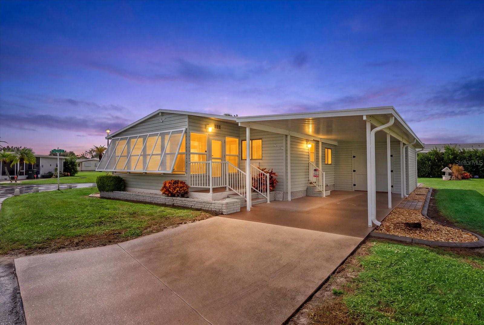 TURNKEY FURNISHED HOME ON A DESIRABLE CORNER LOT WITH MAJOR RECENT UPGRADES! Welcome to 468 Spindrift Drive in Sandalwood Park, an established 55+ community in Venice, Florida. This 2-bedroom, 2-bathroom double-wide manufactured home offers 1,056 square feet of air-conditioned living space and is ready for immediate enjoyment. Recent improvements include a NEW ROOF (December 2024), NEW CARPORT AND LAUNDRY ROOM (2025), NEW YORK A/C SYSTEM (2023), and a TANKLESS WATER HEATER. The ENCLOSED FRONT LANAI features its own mini-split A/C system, providing a comfortable additional space for relaxing or entertaining. The CORNER LOT offers extra outdoor space, including ADDITIONAL PAVER PARKING BEHIND THE HOME. Enjoy LOW-MAINTENANCE LIVING with HOA fees that INCLUDE YARD MAINTENANCE. Sandalwood Park is GOLF CART-FRIENDLY and features a COMMUNITY SWIMMING POOL, CLUBHOUSE, and ON-SITE MANAGEMENT. Conveniently located near Venice's Gulf Coast beaches, shopping, restaurants, parks, and recreational opportunities. NO FLOOD ZONE. Whether you're seeking a seasonal getaway or a year-round residence, this move-in-ready home offers comfort, convenience, and the opportunity to enjoy the Southwest Florida lifestyle. JUST BRING YOUR SUITCASE!