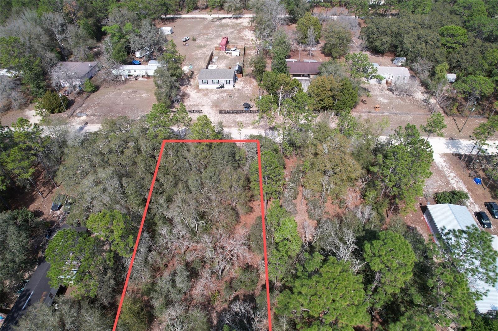 LAND ALREDY CLEARED MOBILE and Manufactured Homes are OK here! NOT in the flood zone. Great road quality. Zoned A-2 agriculture means you can bring your animals, plants, and toys. This property is Marion County parcel number 1744-006-018 This lot is 102x 402= 40,000 Square Feet of land, nearly a full acre! Minutes to everything Dunnellon and Ocala , including the famous Rainbow River State Park. Only 15 minutes or less to the World Equestrian Center. Not far off of Highway 40. No official street number has been assigned to this property as yet. For directions, perhaps the easiest way is to use the address of the new house directly across the street from the property (19107 SW 47TH ST DUNNELLON FL 34432).
