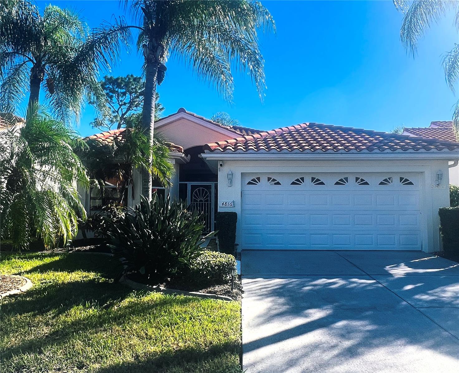 This 2BR 2 BA Plus a Den offers great value in an outstanding neighborhood near everything. Professionally landscaped featuring concrete curbing enclosing flower beds. Hurricane shutters, gutters, extra storage in garage, whole house water filtration, Tesla Charger in garage, all add to this wonderful homes features. Minutes to Venice Beach! Experience quick access to Wellen Park, Downtown Wellen, a variety of restaurants, local concerts, and the Atlanta Braves stadium. You'll also find multiple grocery stores, pharmacies, and essential services just a stone's throw away. This property offers maintenance-free living in a tranquil, beautifully maintained HOA community.