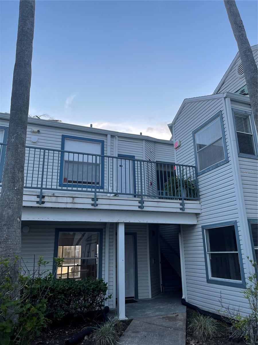 Welcome to this charming 1 bed / 1 bath condo with balcony overlooking a water feature and a beautiful, picturesque sunset in the evening. This Cozy home offers convenience and relaxation in the quiet gated community of Dockside Condominiums. Upgrades include a new front door in 2024, Ceiling fan / light fixtures with upgraded LED lighting (dimmer switches with automated/smart technology) in 2023-2024, new tile in hallway/bathroom 2019 and water-resistant vinyl flooring in bedroom. New AC and Air Handler in 2022. New roof in 2024 with accompanying new gutters. New Fridge 2020, Dishwasher and oven 2019, and Microwave in 2024. Smoke detectors are hardwired. Built in storage in hallway 2024. Ikea Entertainment center stays with home as well as rod and drapes in living area leading to the balcony. Balcony has fake grass and an oversized storage closet with new door in 2024. Boardwalks and New sidewalks throughout community in 2025.Amenities include Pool, tennis, gym/fitness center, gated, assigned parking space and plenty of nearby parking for guests, community trash compactor, and onsite mailboxes, Ventura Country Club, Batting Cages, Orlando International Airport, Shopping, dining, and amusement parks are in nearby vicinity.