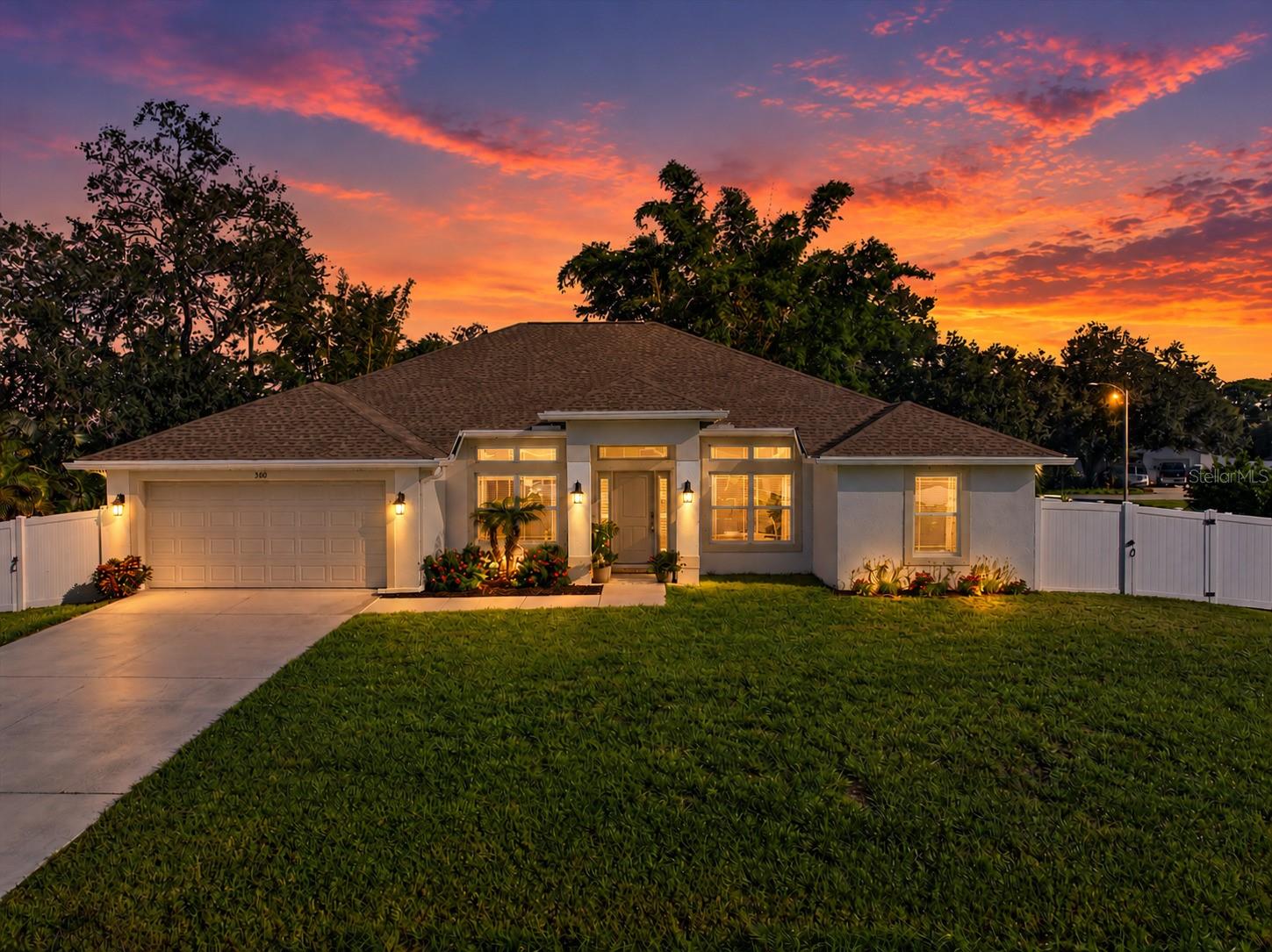 Beautifully maintained, thoughtfully updated, and surrounded by lush tropical landscaping, this South Venice home offers a refreshing blend of modern comfort and Florida charm. This 2021-built home offers 4 bedrooms, 2 bathrooms, 2 office/flex rooms, and 2,169 square feet of living space. Step inside to discover an inviting open floor plan with high ceilings, abundant natural light, and spacious living areas. The kitchen features granite countertops, stainless steel appliances, white cabinetry, a newly installed decorative backsplash, and beautiful patterned tile accents beneath the breakfast bar that add a unique touch of character and style. The generously sized primary suite offers updated wood-look flooring, an organized closet with custom built-ins, and a spacious bathroom featuring a walk-in shower and garden tub with beautiful custom tile work. One of this property's most impressive features is the incredible backyard oasis! Enjoy a screened lanai, an additional 512 square feet of patio space, white vinyl fencing, and lush, established landscaping with mature shade trees, tropical plants, and an abundance of fruit trees and edible plants, including avocado, citrus, guava, banana, coconut, and more! Additional highlights include a NEW ROOF (2025), whole-house reverse osmosis system with a 500-gallon tank, Kinetico water treatment system, generator hookup, plantation shutters, custom roller shades, security system, and extensive storage upgrades. Conveniently located near Manasota Key beaches, shopping, dining, and the South Venice Beach Ferry, this home offers a wonderful opportunity to enjoy the Southwest Florida lifestyle. Schedule your private showing today!