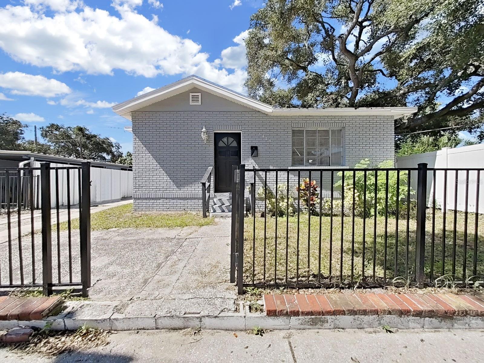 Fully Remodeled 4-Bedroom Home | Granite Countertops | Tile Flooring Throughout | Convenient Tampa Location!
Welcome to this beautifully remodeled 4-bedroom, 2-bathroom home, ready for its new owner! Featuring contemporary finishes, fresh interior paint, and tile flooring throughout, this home offers a comfortable layout with modern style and functionality.
The spacious living and dining areas flow seamlessly into the kitchen, creating an inviting open-concept space ideal for everyday living and entertaining. The kitchen features attractive dark wood cabinetry, granite countertops, and ample workspace for meal preparation and gathering with family and friends.
The generously sized primary bedroom features a large closet with a convenient organization system and a sliding glass door that provides direct access to the backyard. The remodeled primary bathroom offers a relaxing soaking tub, creating a comfortable space to unwind. Three additional bedrooms share the second bathroom, which features a walk-in shower.
Additional conveniences include a dedicated laundry room and a side entrance for easy access when bringing in groceries or coming home on rainy days. The backyard shed provides extra storage for lawn equipment, tools, and other belongings.
Existing appliances, washer and dryer, window blinds, light fixtures, and ceiling fans are included with the home.
Enjoy a convenient Tampa location just minutes from I-275, I-4, and historic Ybor City, where you can explore local shops, restaurants, and entertainment. Downtown Tampa is approximately 2–3 miles away, and Tampa International Airport is approximately 8 miles away, offering convenient access to downtown attractions, commuting routes, and air travel.
Don't miss this opportunity to own a beautifully remodeled home in a convenient Tampa location! Contact us today for more information or to schedule your showing.