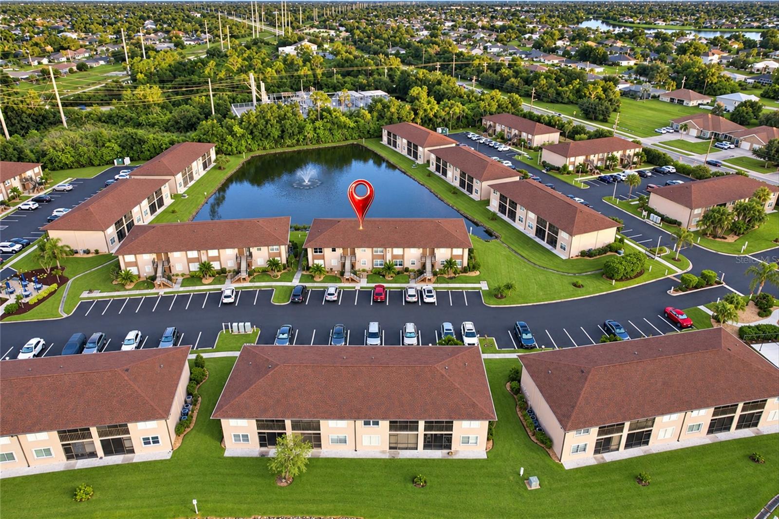 WELCOME TO DEEP CREEK GARDENS! Enjoy peaceful LAKEFRONT LIVING in this inviting 2-BEDROOM, 2-BATHROOM SECOND-FLOOR CONDO, offered FURNISHED and ready for you to enjoy! This well-maintained residence features a BRIGHT AND SPACIOUS OPEN-CONCEPT LIVING AND DINING AREA, creating a comfortable setting for everyday living and entertaining. The spacious living room showcases neutral carpeting, a ceiling fan, and sliding glass doors leading to the PRIVATE SCREENED LANAI overlooking the lake. The adjoining dining area flows seamlessly into the kitchen, creating an open and functional layout. The WELL-APPOINTED KITCHEN features GRANITE COUNTERTOPS, light gray cabinetry with sleek hardware, a SUITE OF APPLIANCES, a convenient breakfast bar with seating, and ample cabinet and counter space. Tile flooring in the kitchen adds practicality and easy maintenance. The thoughtfully designed layout offers TWO GENEROUSLY SIZED BEDROOMS with walk-in closets, each with its own bathroom, providing comfort and privacy for residents and guests alike.  Both bathrooms offer single-sink vanities, with one featuring a tub/shower combination and the other a WALK-IN SHOWER. Additional highlights include an NEW HVAC, IN-UNIT WASHER AND DRYER and HURRICANE SHUTTERS for added peace of mind. Step outside to your PRIVATE SCREENED LANAI, where you can relax and take in tranquil lake views while enjoying the beautiful Florida weather. Deep Creek Gardens offers a MAINTENANCE-FREE LIFESTYLE with an impressive array of RESORT-STYLE AMENITIES, including a HEATED COMMUNITY POOL, CLUBHOUSE, TENNIS AND PICKLEBALL COURTS, BOCCE BALL AND SHUFFLEBOARD COURTS, and a covered community cookout area complete with tables, chairs, and grills. For added convenience, an additional grilling area with tables and umbrellas is located just steps from the condo near Building I. AMPLE PARKING is available for both residents and guests. Conveniently located near I-75, shopping, dining, golf courses, and everyday conveniences, this condo is ideal for a seasonal retreat or year-round residence. Don't miss your opportunity to enjoy the Florida lifestyle in this welcoming community!