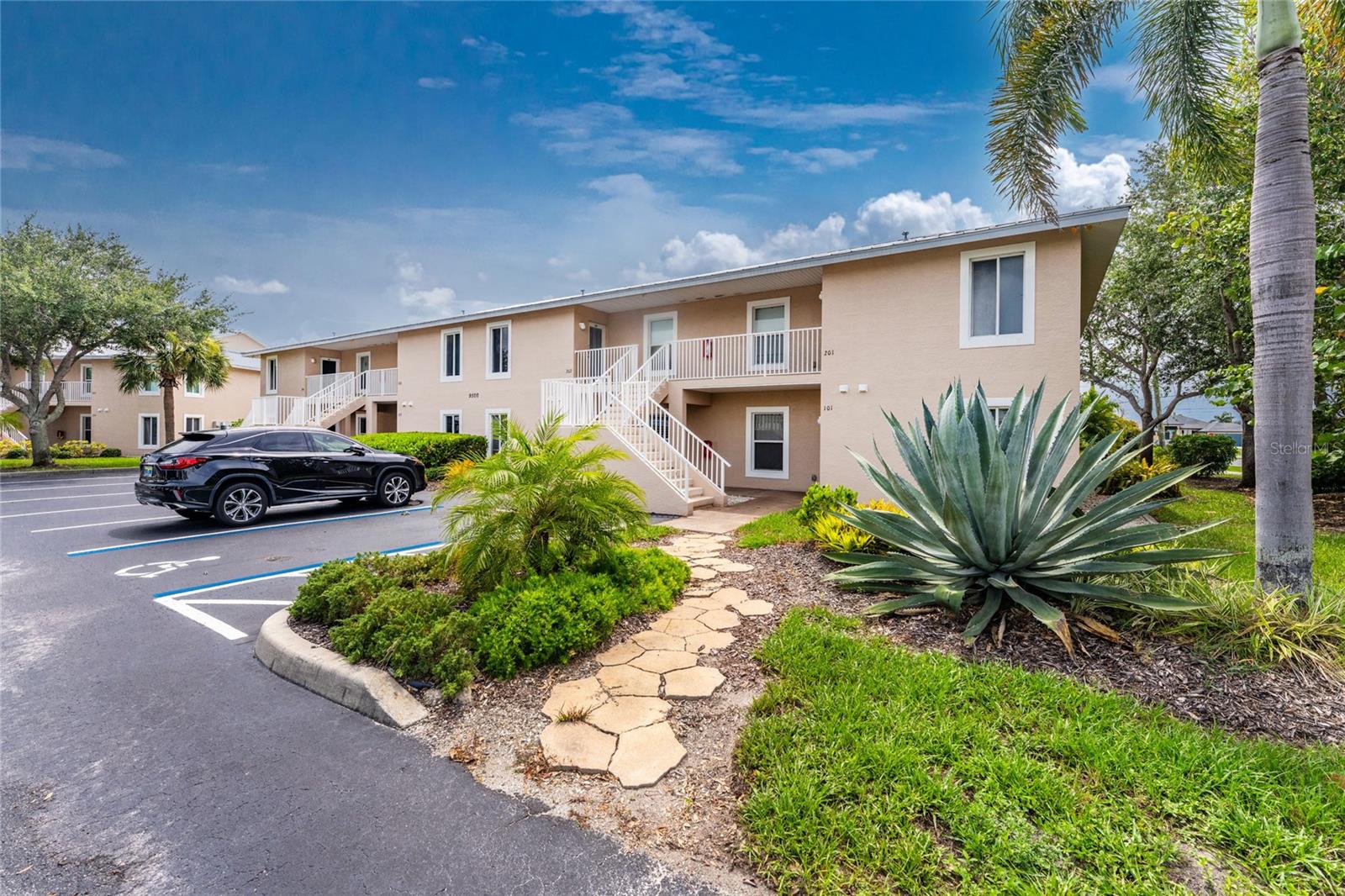 Rarely available first-floor end unit in the highly desirable Fiddler's Green Nature Trail community! Ideally located in Building 1, this bright and inviting two-bedroom, two-bath condominium is just steps from the heated pool and clubhouse while offering peaceful wooded views from the private screened lanai. As an end unit, the home features additional windows that fill the living space with natural light and create an open, airy feel. The first-floor location provides the convenience of no stairs, easy access to the community amenities, and a simple way to take pets outside. Offered fully furnished and move-in ready, the home has been freshly painted and includes all-new furniture, new ceiling fans, replaced toilets, ceramic tile in the kitchen, and luxury vinyl plank flooring throughout the living room, dining room, and bedrooms. The spacious floor plan features a generously sized kitchen that opens to the main living and dining areas. The screened lanai extends the living space and provides a comfortable place to relax while enjoying the private natural setting. The primary bedroom includes an ensuite bathroom and ample closet space, while the guest bedroom and second full bathroom provide comfortable accommodations for family and visitors. Interior laundry and additional storage add to the home's everyday convenience. Fiddler's Green Nature Trail is a beautifully landscaped, pet-friendly community offering a heated swimming pool, clubhouse, tennis courts, grilling area, and nearby walking and biking trails. The community is conveniently located near golf courses, marinas, boating, shopping, restaurants, medical facilities, world-class fishing, and the Gulf beaches of Englewood and Boca Grande. Whether you are looking for a full-time residence, seasonal retreat, or investment property, this furnished first-floor end unit offers a comfortable and convenient opportunity to enjoy the Southwest Florida lifestyle.