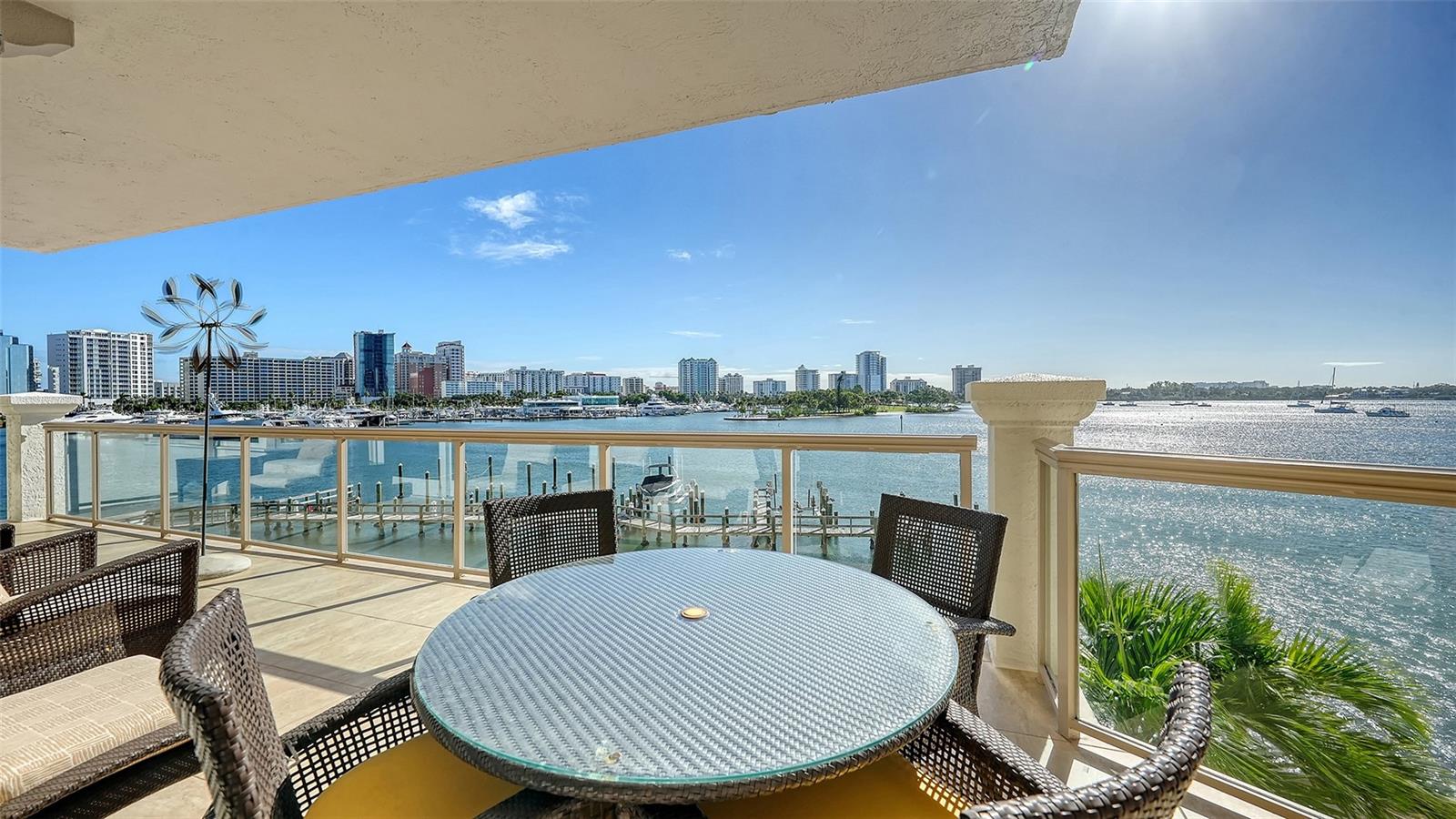 Beautifully renovated, freshly furnished, and ready for immediate enjoyment, this exceptional direct-bayfront residence at La Bellasara offers the perfect combination of luxury, comfort, and convenience on coveted Golden Gate Point. Positioned on the third floor, Residence #304 captures panoramic views of Sarasota Bay, the marina, and downtown skyline. Offering nearly 3,300 square feet of interior living space plus generous private terraces, this expansive residence has been freshly painted in neutral tones and beautifully appointed with brand-new contemporary furnishings throughout, boat dock, and two-car garage, all included in the sale.

A private elevator opens directly into the gracious foyer leading to the impressive Grand Salon, where soaring 11-foot tray ceilings, marble flooring, crown molding, and walls of floor-to-ceiling glass create an elegant setting for waterfront living. A gas fireplace and wet bar with wine refrigeration enhance the entertaining space, while expansive sliding glass doors open to the generous bayfront terrace overlooking the marina and open water.

The newly refreshed kitchen is light, bright, and beautifully updated with new quartz countertops complementing custom cabinetry. A spacious center island with breakfast bar seating, premium appliances including a gas cooktop and built-in ovens, and abundant pantry storage complete this inviting space. The adjoining dining area enjoys beautiful water views, creating a seamless connection between cooking, dining, and entertaining.

The spacious primary suite is a private waterfront retreat featuring its own bayfront terrace, dual walk-in closets, and separate marble-appointed his-and-her bathrooms. Two additional bedroom suites are thoughtfully positioned for privacy, each with a walk-in closet, en-suite bath, and private balcony. A separate study/library with closet provides flexibility for a home office, den, or fourth bedroom.

Additional conveniences include a private two-car garage, secure storage, and a private dock with the potential to add a boat lift. The current owner has also paid the community's upgrade investment in full for the brand-new lobby renovation currently underway, providing an added benefit to the next owner.

La Bellasara is an exclusive gated waterfront community offering on-site management, a resort-style swimming pool and spa, fitness center, and beautifully maintained grounds. Its desirable Golden Gate Point location places Downtown Sarasota's restaurants, boutiques, galleries, theaters, and waterfront attractions within easy reach. Enjoy nearby Marina Jack, Marie Selby Botanical Gardens, Burns Court, and The Bay Park, while St. Armands Circle, Lido Beach, and Longboat Key are just a short drive away.

With its recent renovations, brand-new furnishings, private dock, expansive bayfront terraces, and exceptional downtown location, La Bellasara #304 offers a truly move-in-ready Sarasota waterfront lifestyle. Simply arrive, settle in, and enjoy.