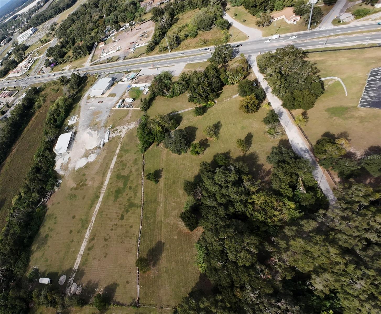 This property holds the rare B5 zoning at a prime location on HWY 27 not even a half mile east of I75. City water is available at site
and sewer connections are nearby. The median cut on HWY 27 allows ingress and egress from both traveling directions. The
property is dry and flat, ready to be developed by someone who requires the elusive heavy commercial zoning on a major highway.
Recent developments within half a mile of this parcel includes UF Health ER, Quality Inn, and Race Trac. Not to mention the plethora
of other commercial retailers and distributors within just a short drive down the road. First phase environmental available. Survey attached. Owner financing available. The possibilities are endless!