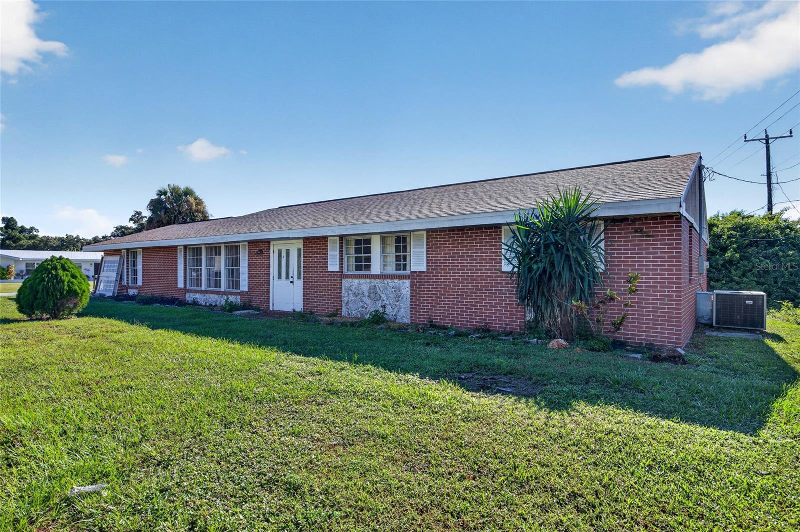 LIVE HERE OR WORK HERE, THE OPTION IS YOURS! This 3-bedroom, 2-bath brick home sits on a 13,000 sq ft corner lot just off US-41 in Port Charlotte, with CG (COMMERCIAL GENERAL) ZONING that opens the door to commercial or residential use.

THE HIGHLIGHTS: 3 BEDS | 2 BATHS | 2,200 SQ FT | CORNER LOT | CG ZONING | STEPS FROM US-41 | COVERED LANAI | PUBLIC WATER & SEWER

ROOM TO GROW. With 2,200 heated sq ft, there is space for everyone. The living room (approximately 23' x 15') opens to a dining room (approximately 18' x 15'), and a separate FAMILY ROOM (approximately 19' x 20') is ready to become a media room, home office, studio or client waiting area. TILE FLOORS run throughout for easy upkeep.

FLEXIBLE FLOOR PLAN. The kitchen has plenty of cabinet and counter space plus an INSIDE LAUNDRY ROOM. The primary bedroom includes DUAL CLOSETS and its own bath with a walk-in shower, and two generous guest bedrooms share a second full bath.

OUTDOOR SPACE. Sliding glass doors lead to a COVERED REAR LANAI (approximately 28' x 14'), a great spot for morning coffee or weekend cookouts. The corner lot provides a driveway, extra yard space and great visibility.

LOCATION. Just off US-41 (Tamiami Trail) near shopping, dining, services and everyday conveniences, with an easy drive to Punta Gorda, Venice and area beaches. Bring your vision: a solid home, a home-based business or a future commercial site. Buyer to verify intended use with Charlotte County.

PROPERTIES WITH THIS KIND OF ZONING AND LOCATION RARELY COME ALONG. Schedule your showing today.